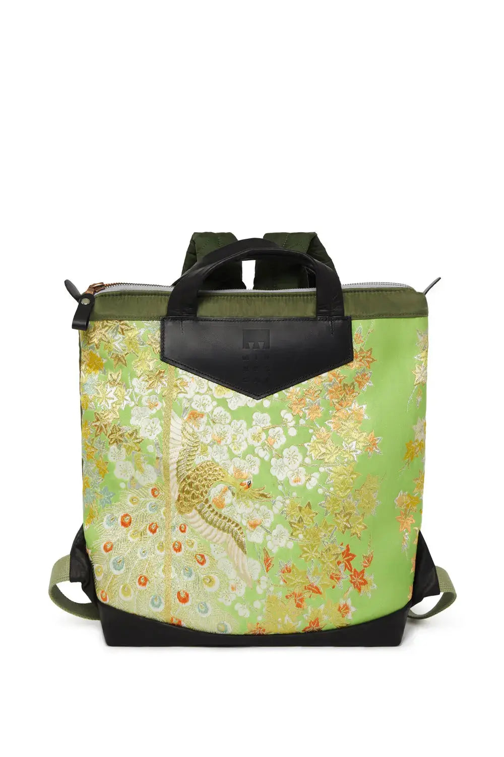 Green floral-patterned backpack with black accents on a white background