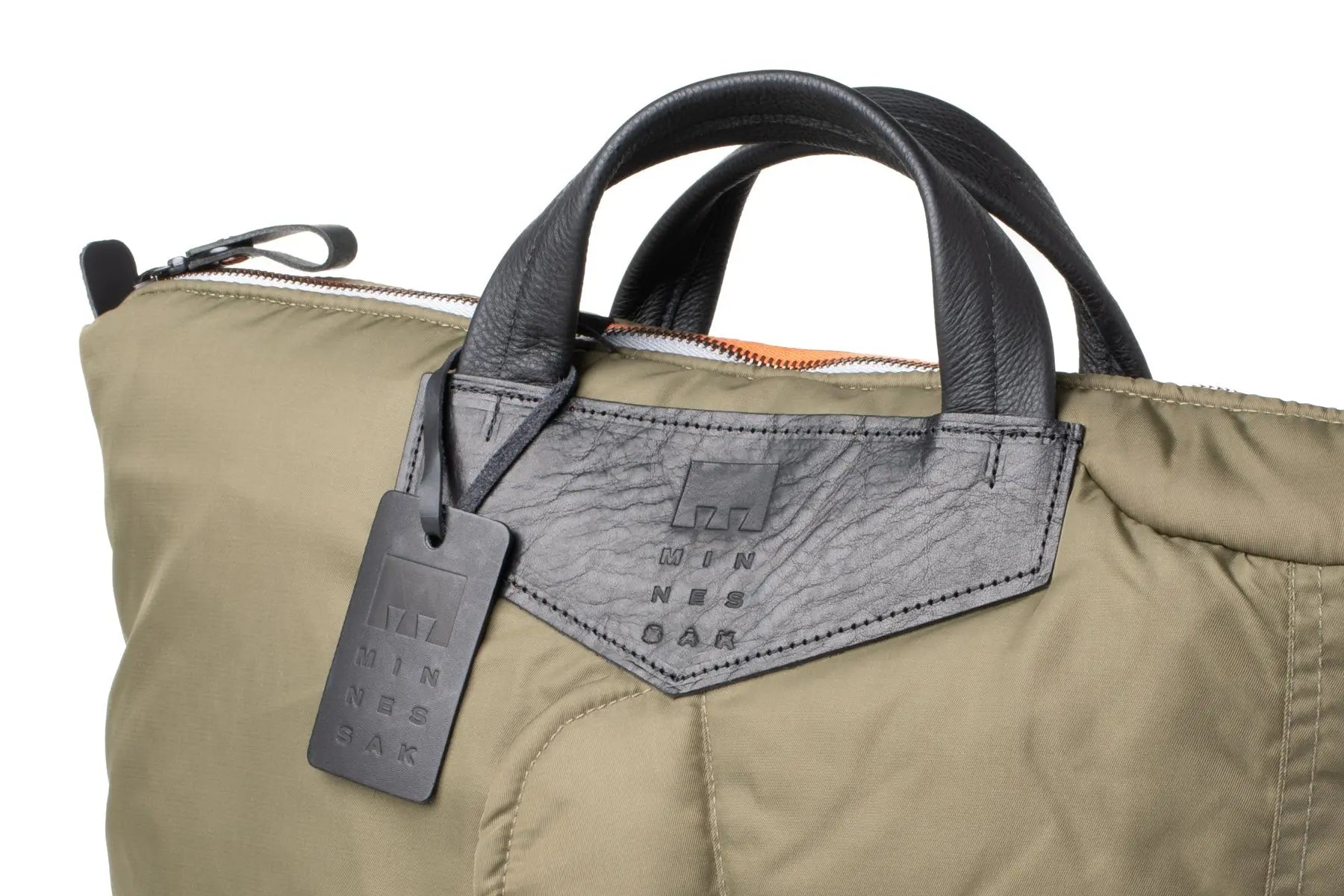 Olive Khaki bag with a black tag on a white background