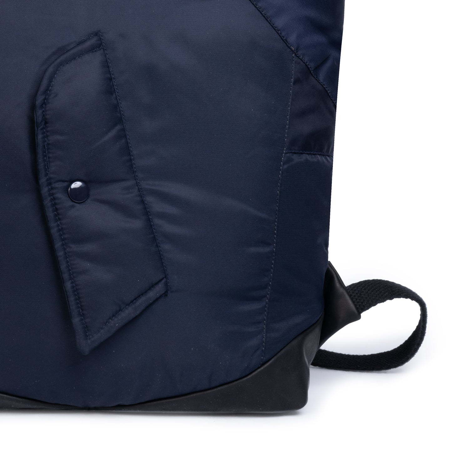 Navy blue backpack with a button detail on a white background