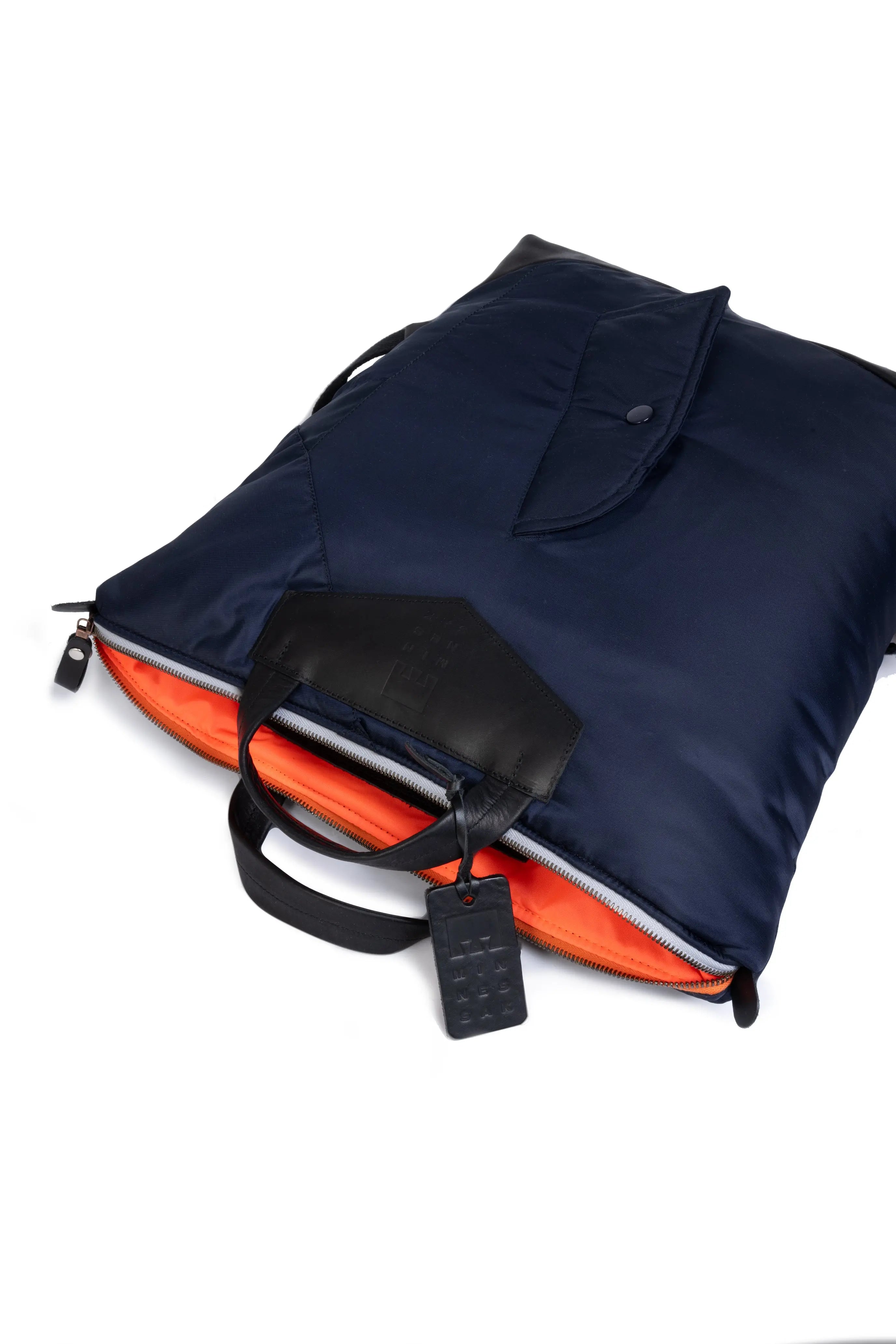 Navy blue and orange interior with a black handle on a white background