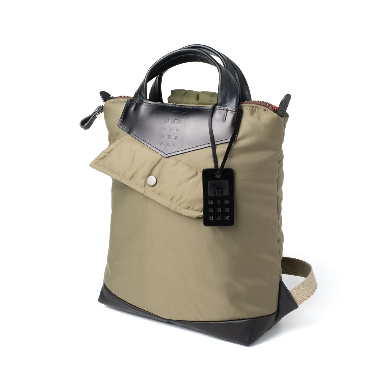 Olive handbag with black accents on a white background