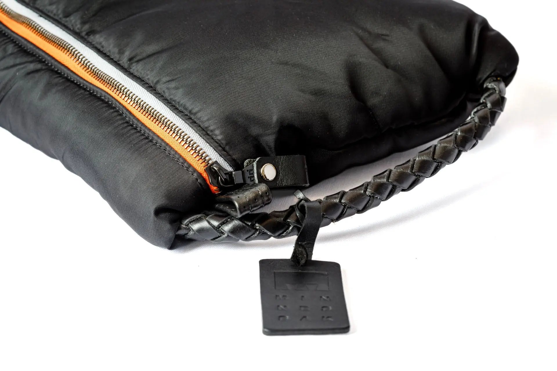 Black Lap It Up Corded bag with zip and straped hand with logo on a white background