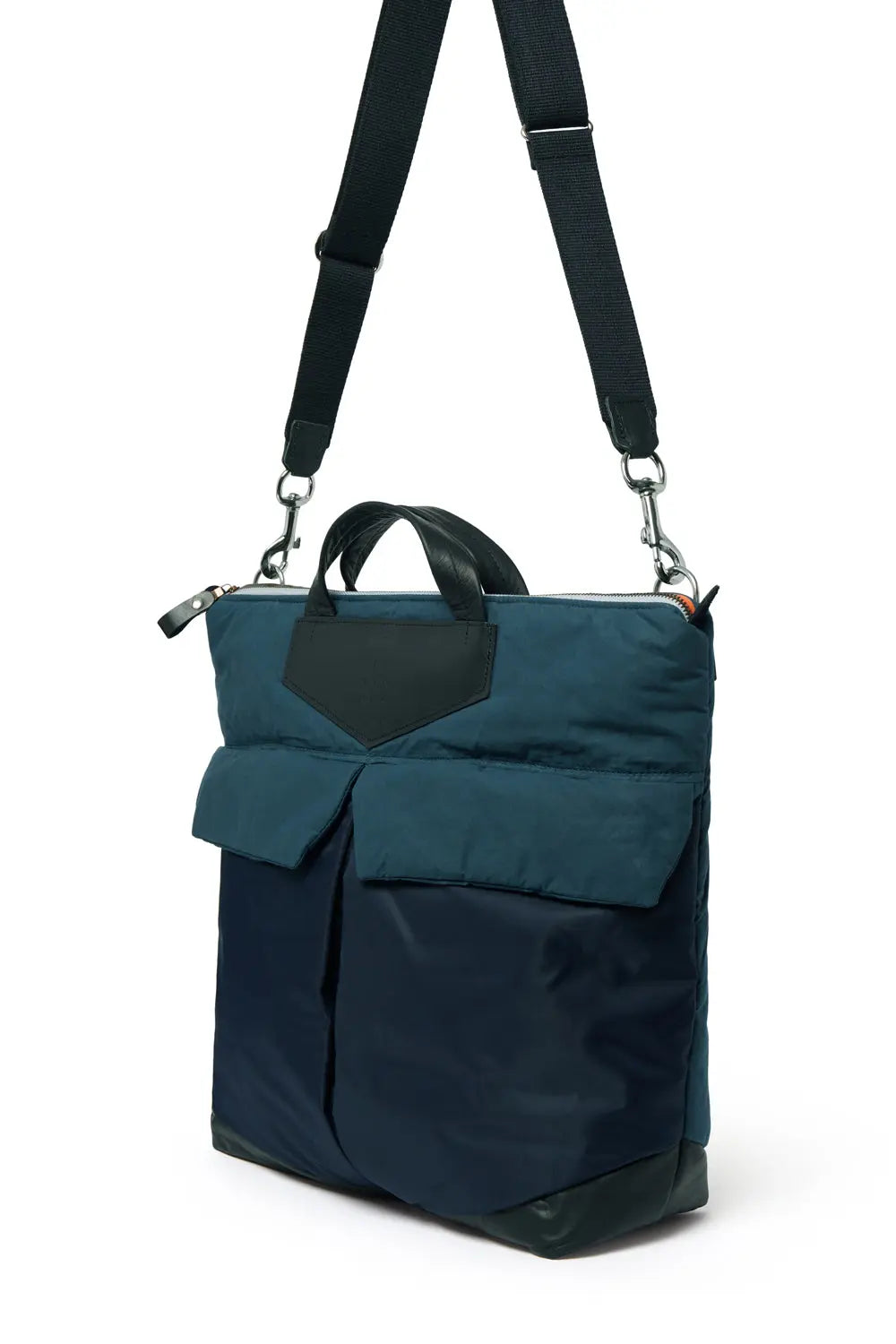 Navy backpack with a black strap on a white background
