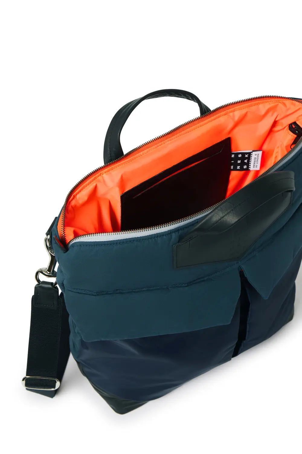 Open Navy backpack with orange interior on a white background