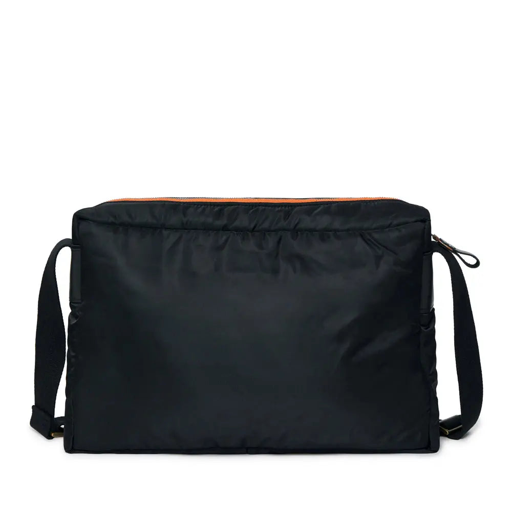 Black shoulder bag with orange interior lining on a white background