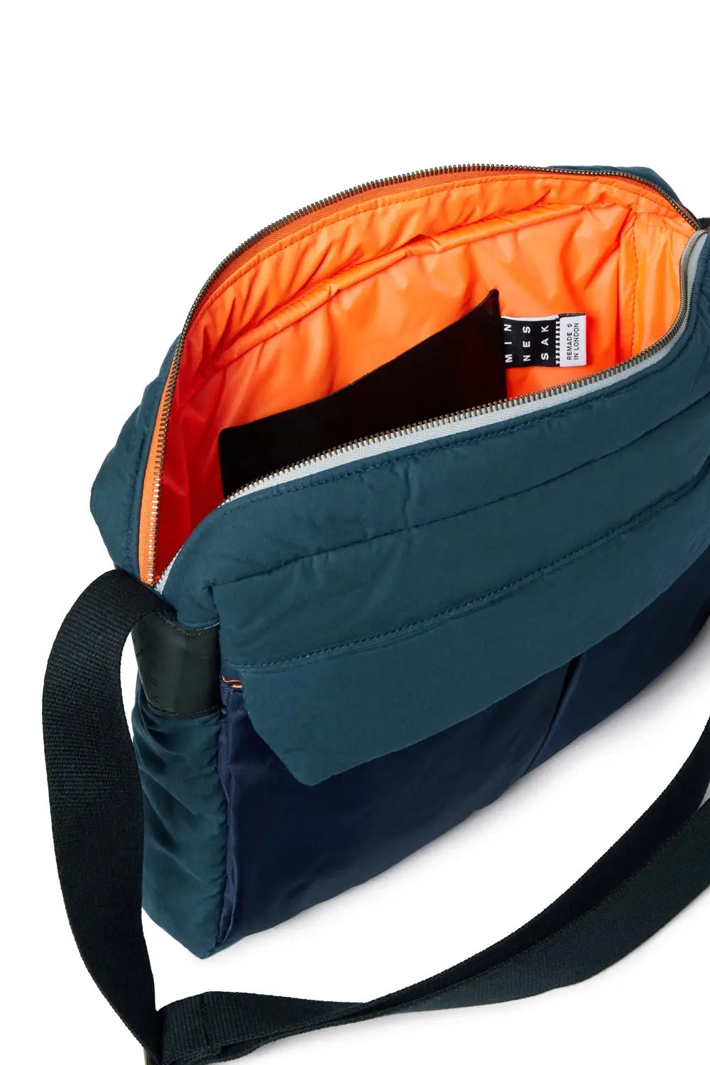 Blue shoulder bag with orange interior on a white background
