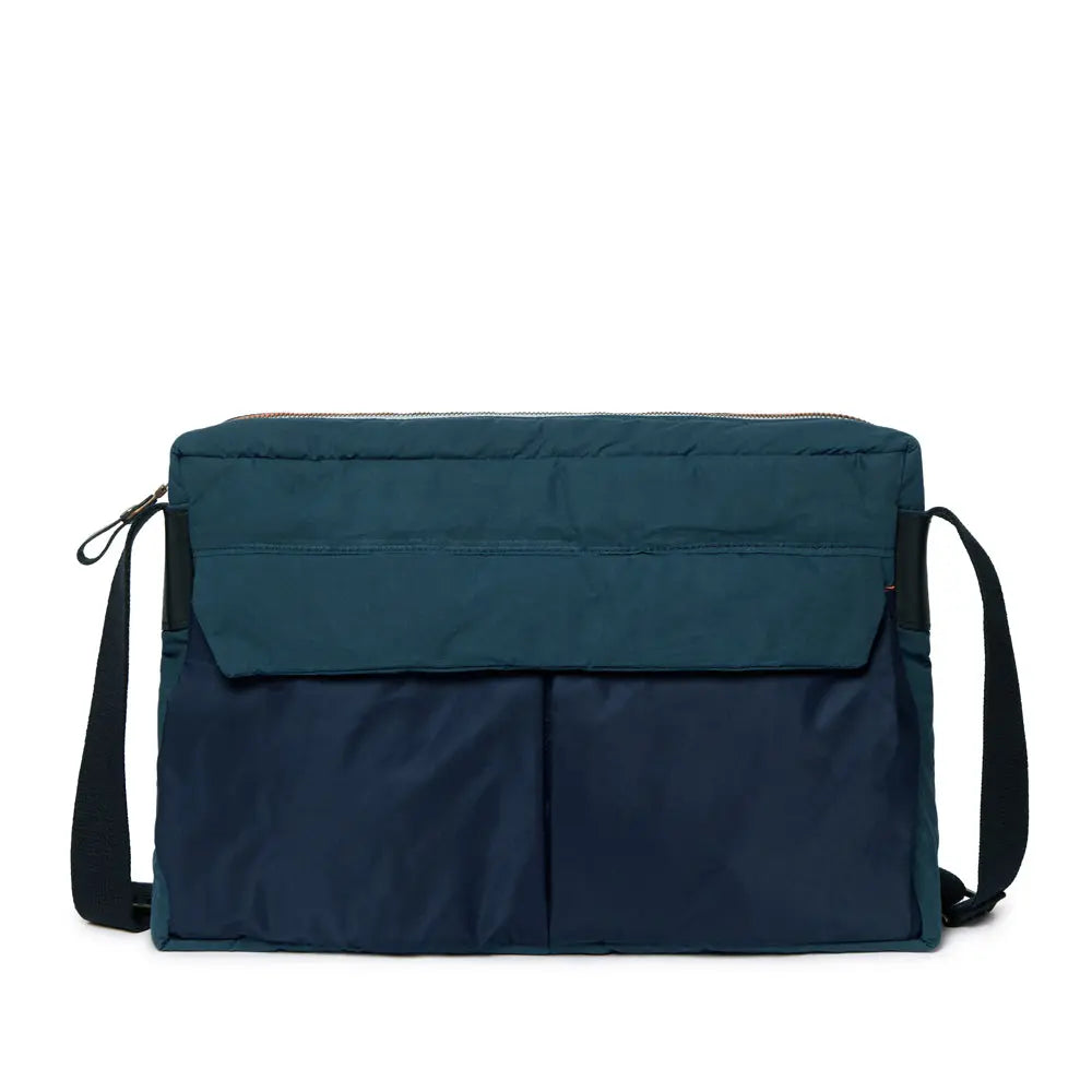 Navy and teal bag with a shoulder strap on a white background