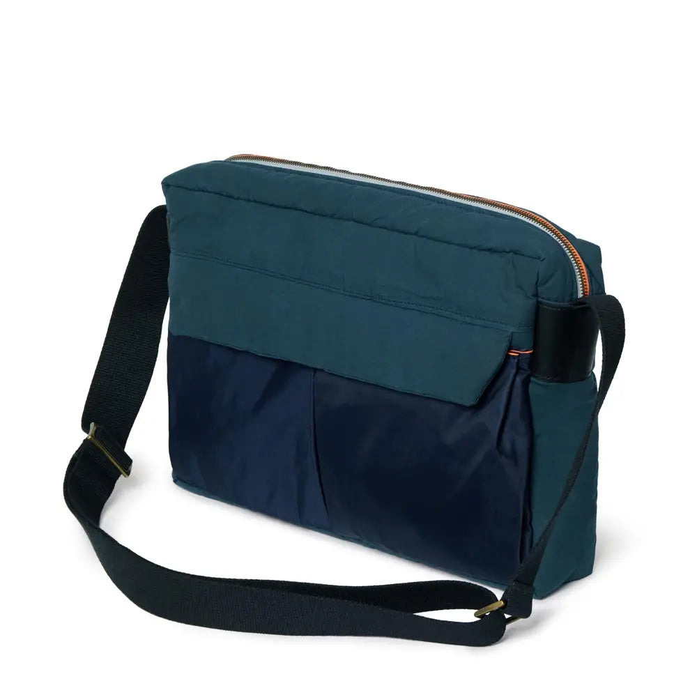Navy and teal shoulder bag on a white background
