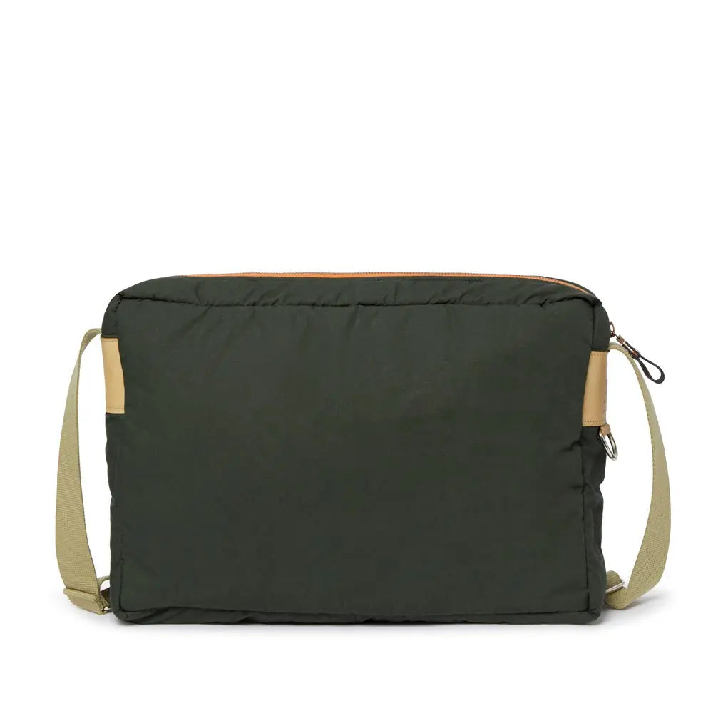 Olive bag with beige strap on a white background