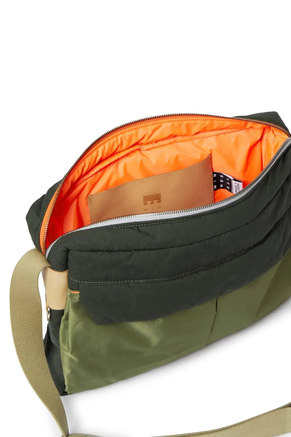 Green and gray bag with orange interior on a white background
