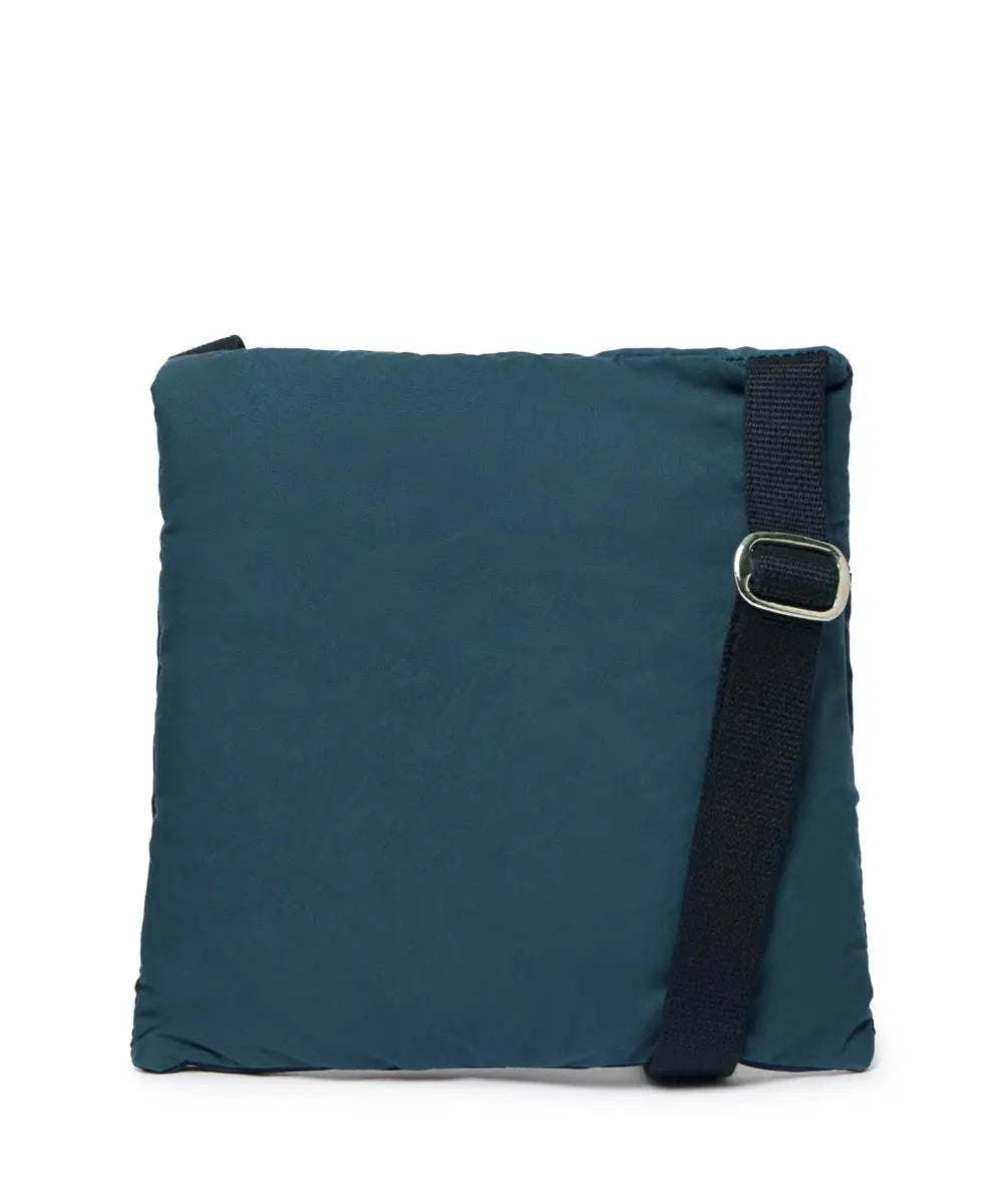 Navy bag with a black strap on a white background