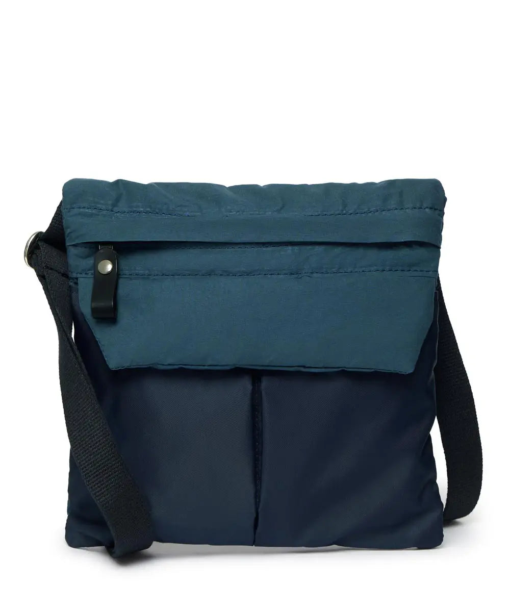 Navy crossbody bag with a black strap on a white background
