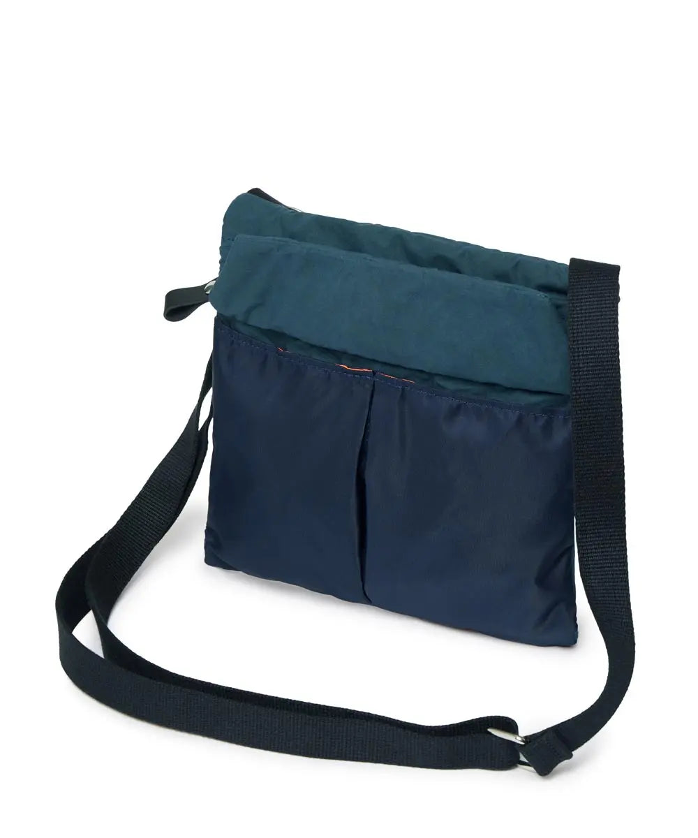 Navy and teal crossbody bag on a white background