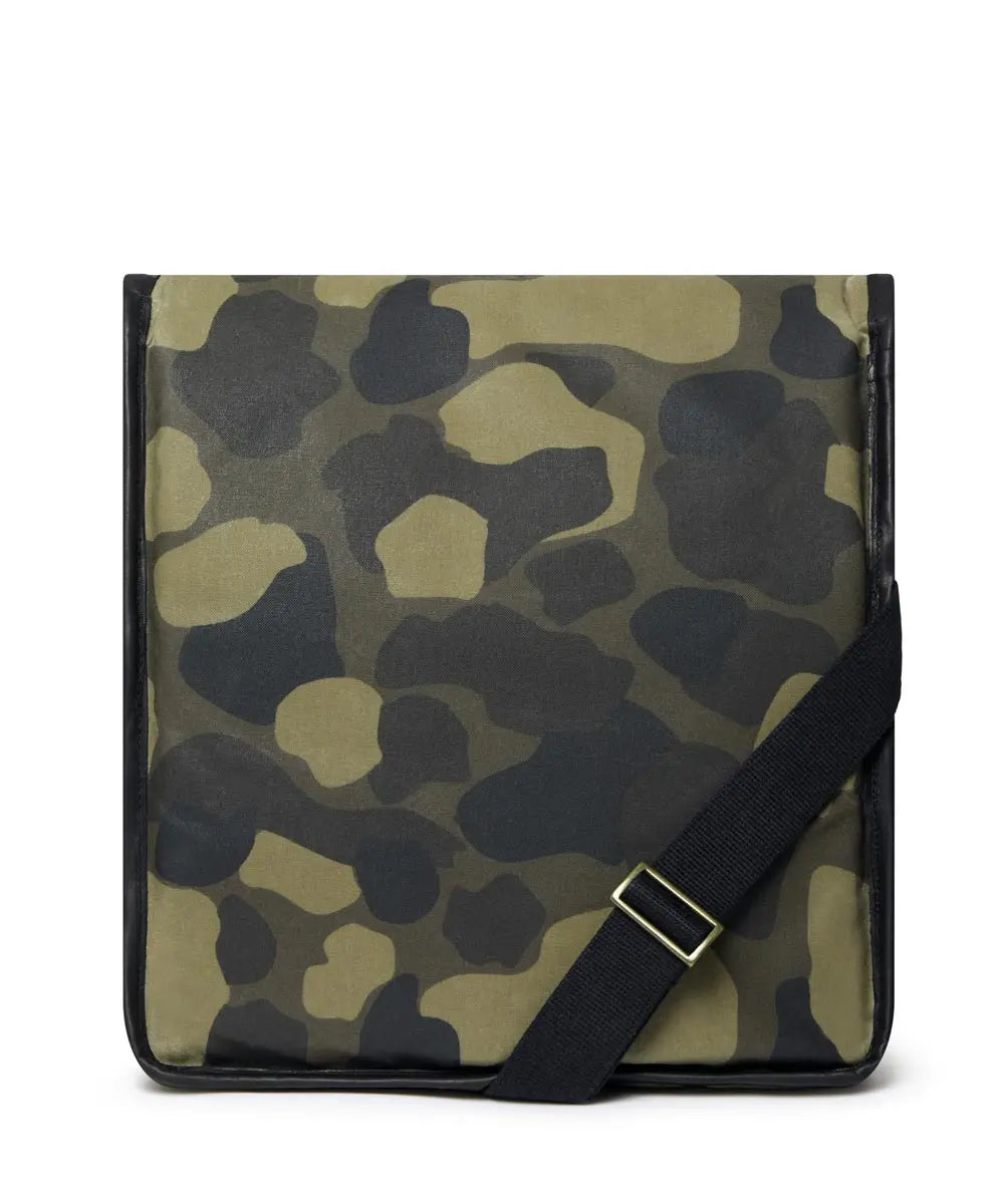 Camouflage-patterned bag with a black strap on a white background