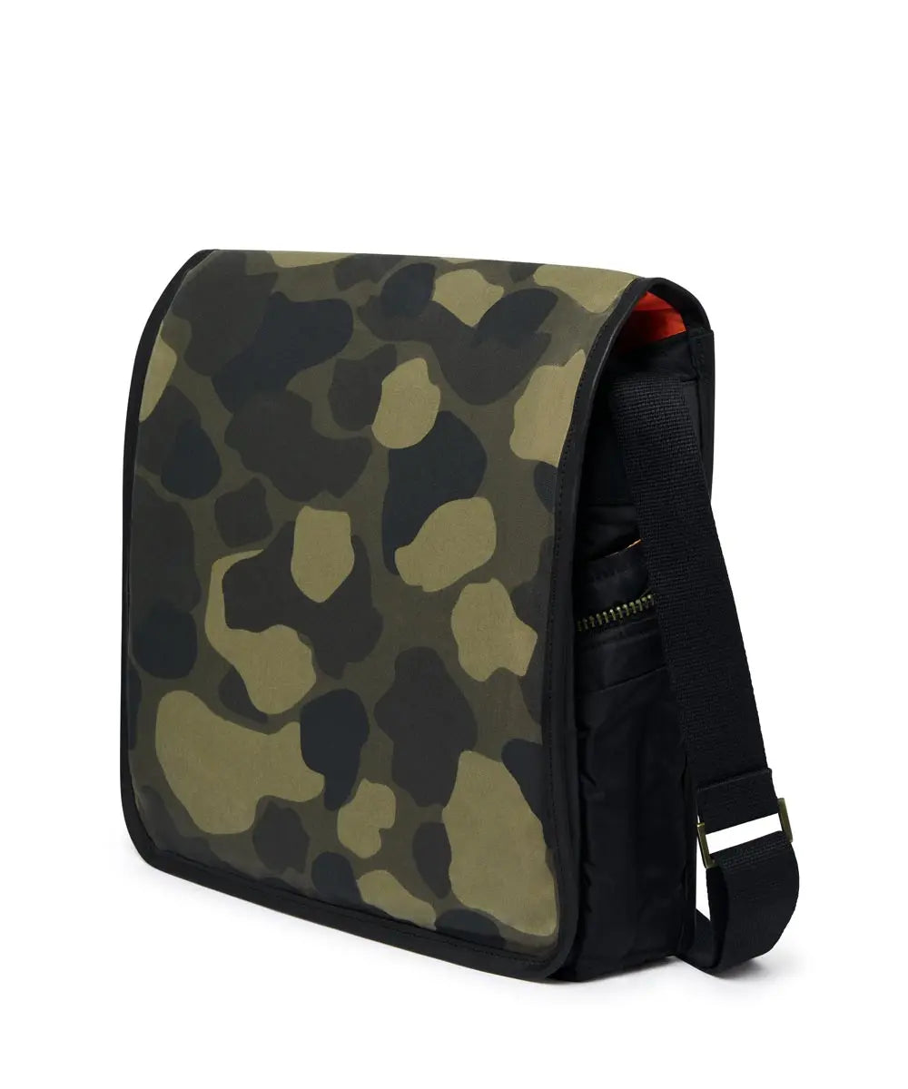 Camouflage-patterned bag with a black strap on a white background