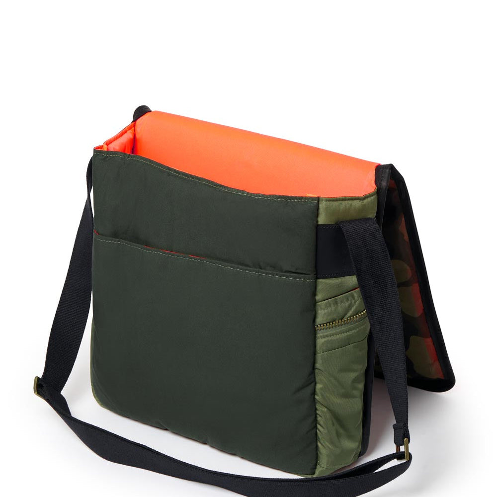 Multicolored bag with Olive, orange, and black sections on a white background