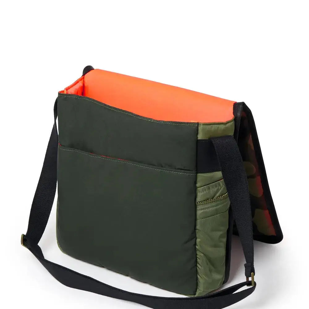 Multicolored bag with Olive, orange, and black sections on a white background