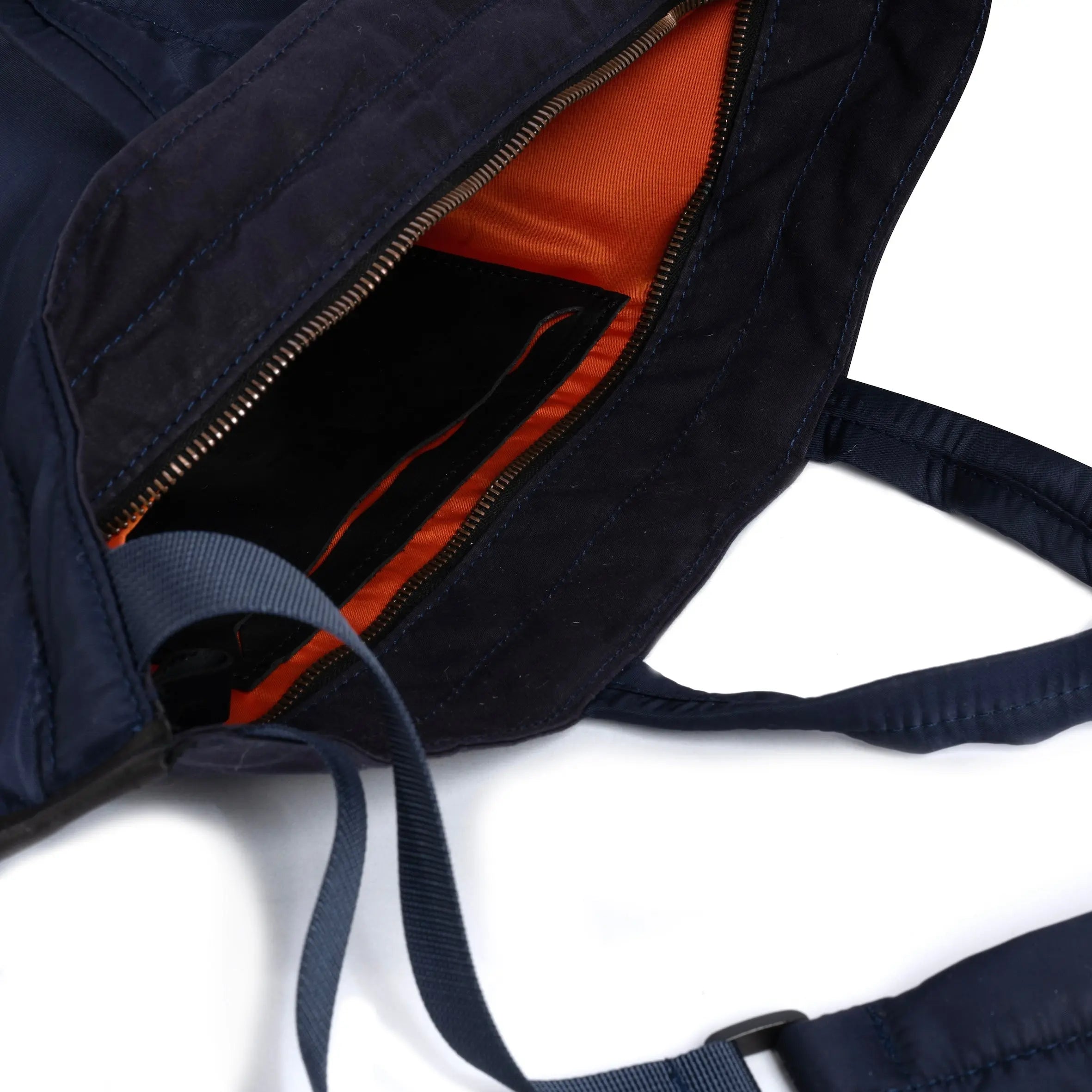 Navy blue medium size tote bag showing strap and internal detail white background