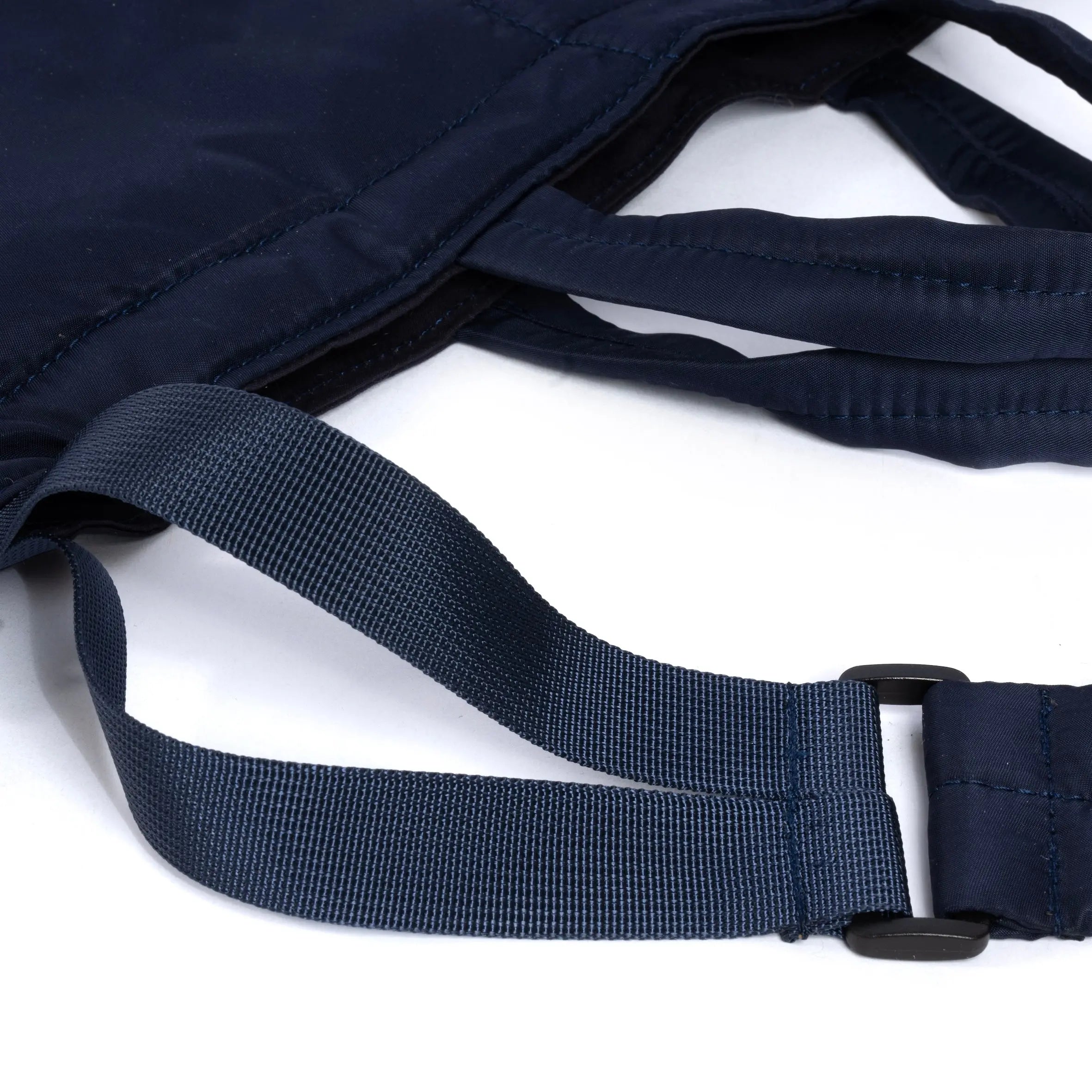 Navy blue medium size tote bag showing strap detail on white background