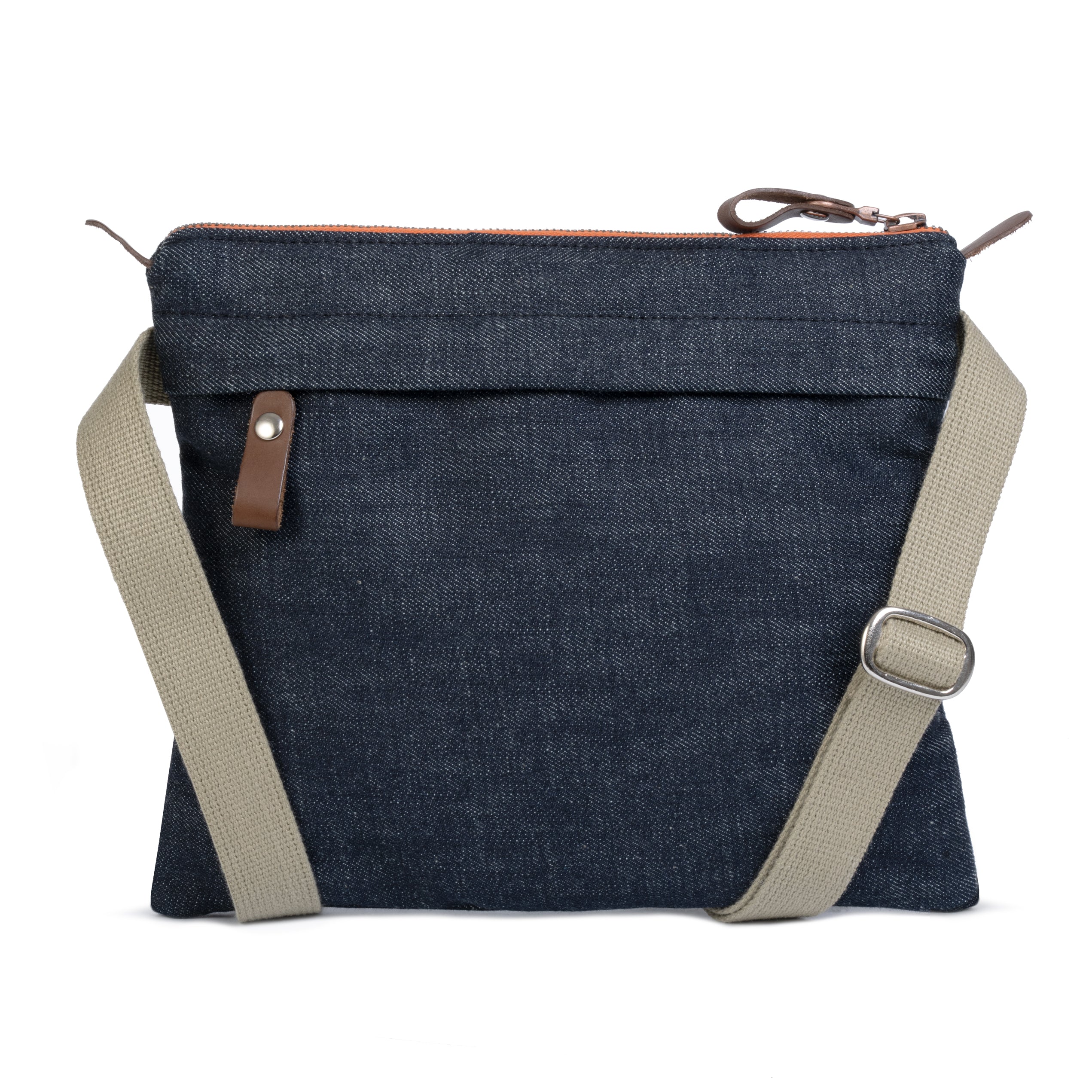 Blue denim crossbody bag with beige strap on a white background