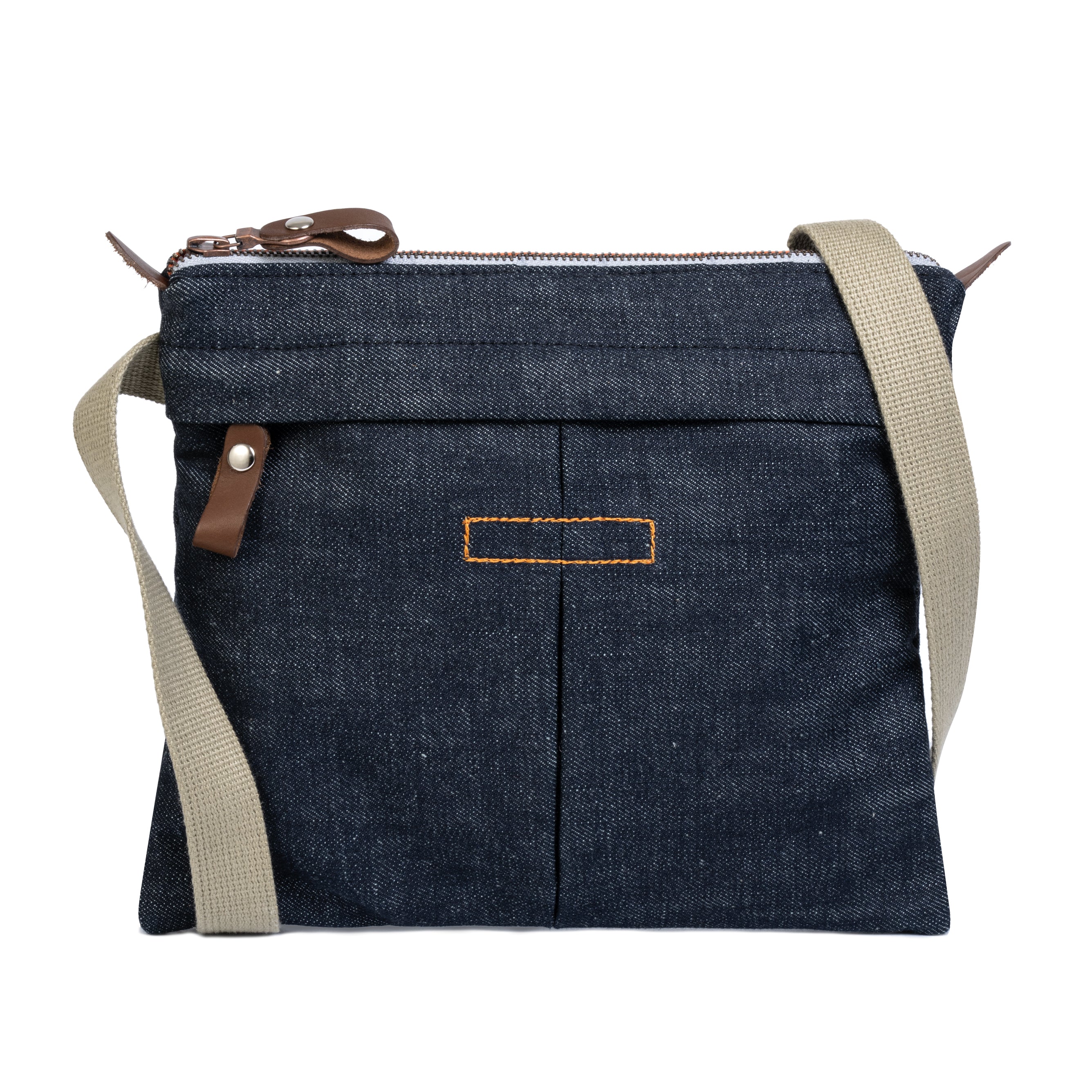 Blue denim crossbody bag with beige strap on a white background