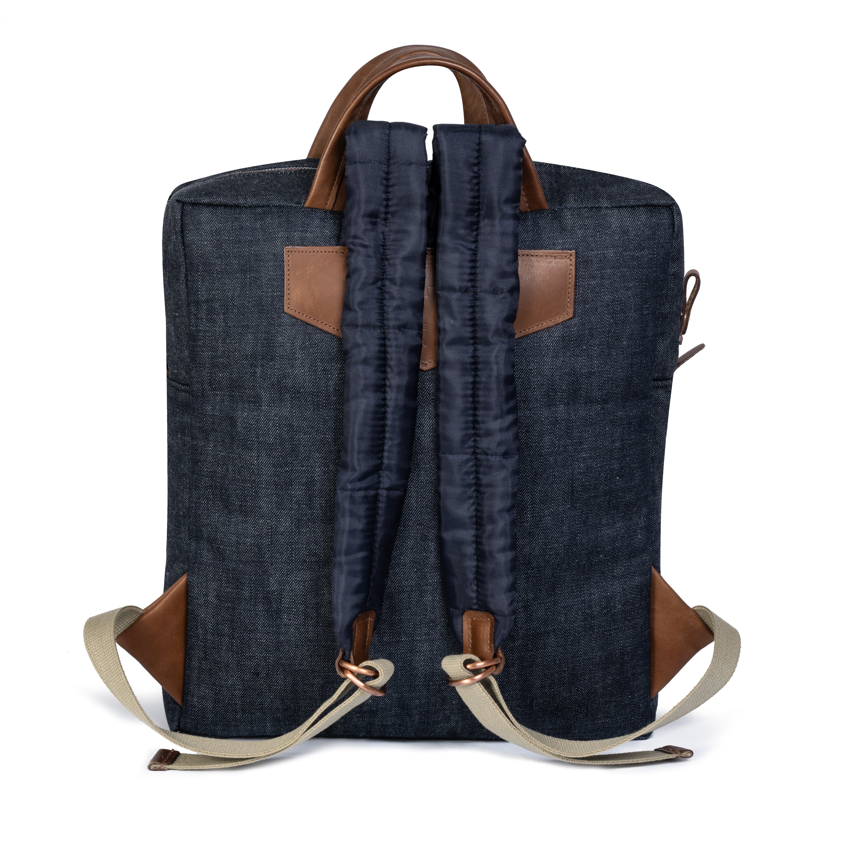 Blue denim backpack with brown leather straps on a white background