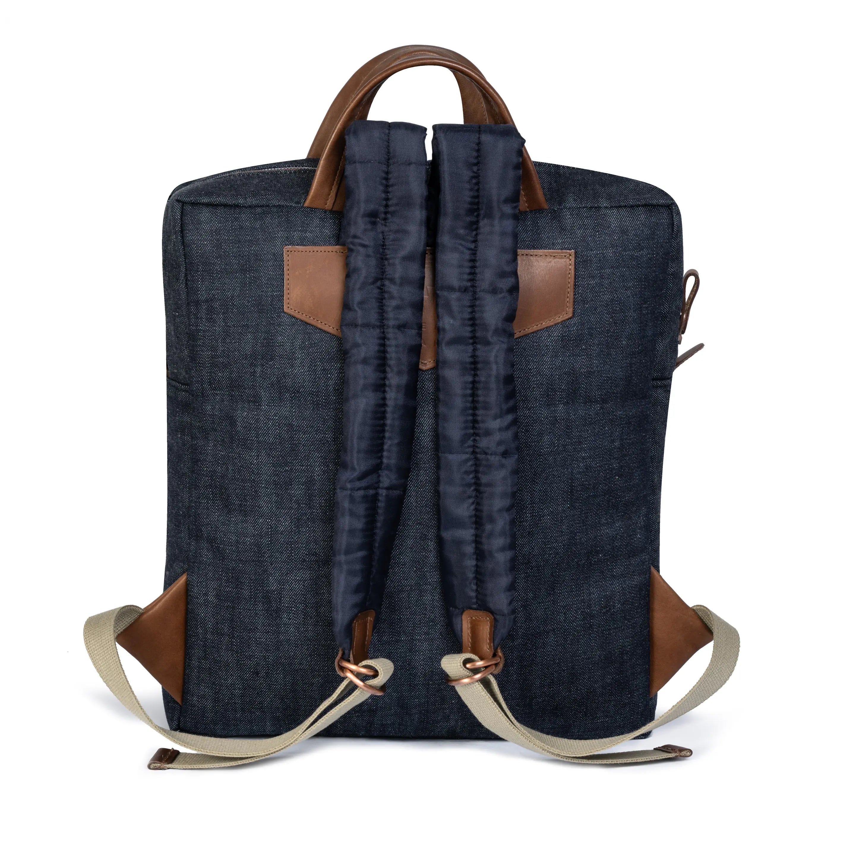 Blue denim backpack with brown leather straps on a white background