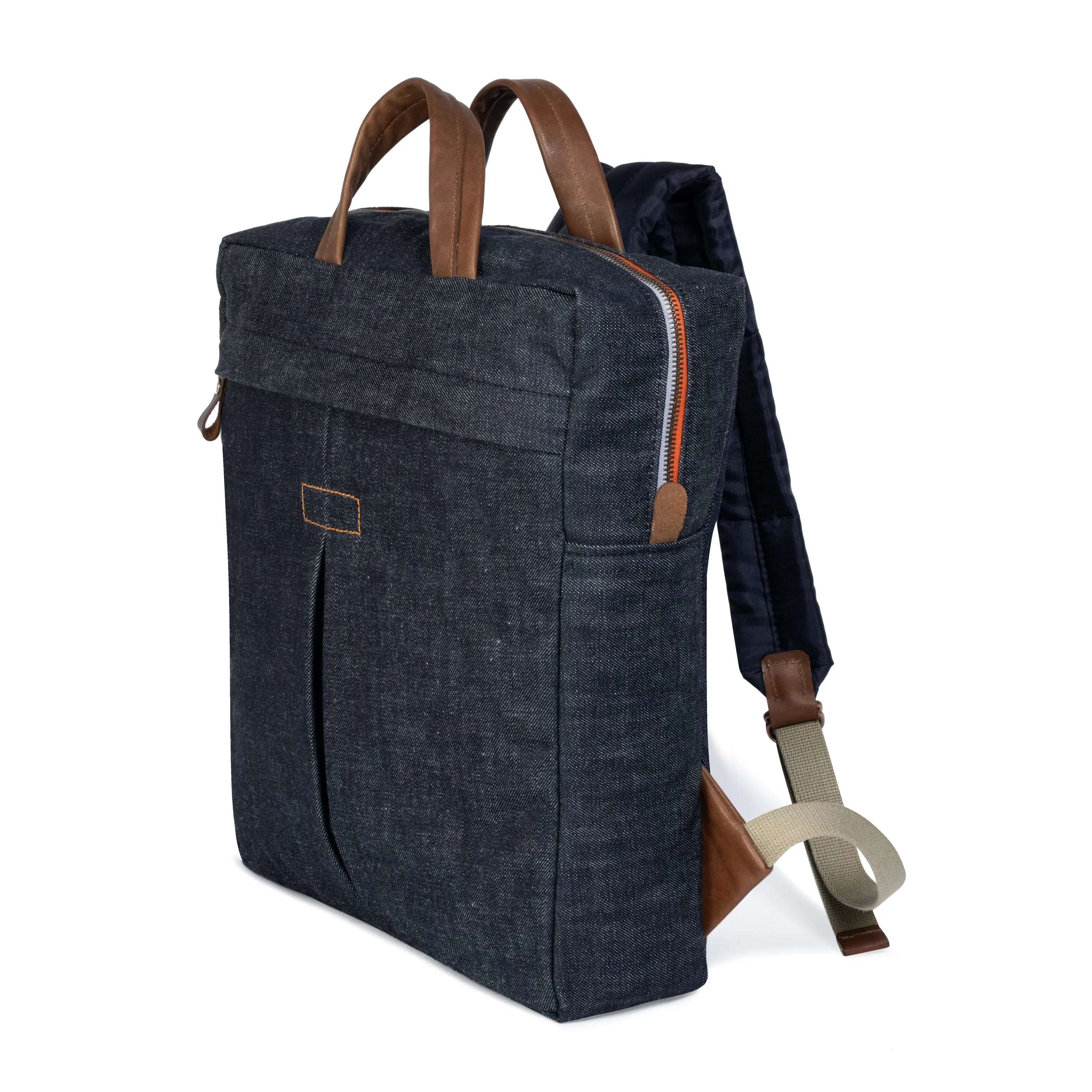 Blue denim backpack with brown leather straps on a white background