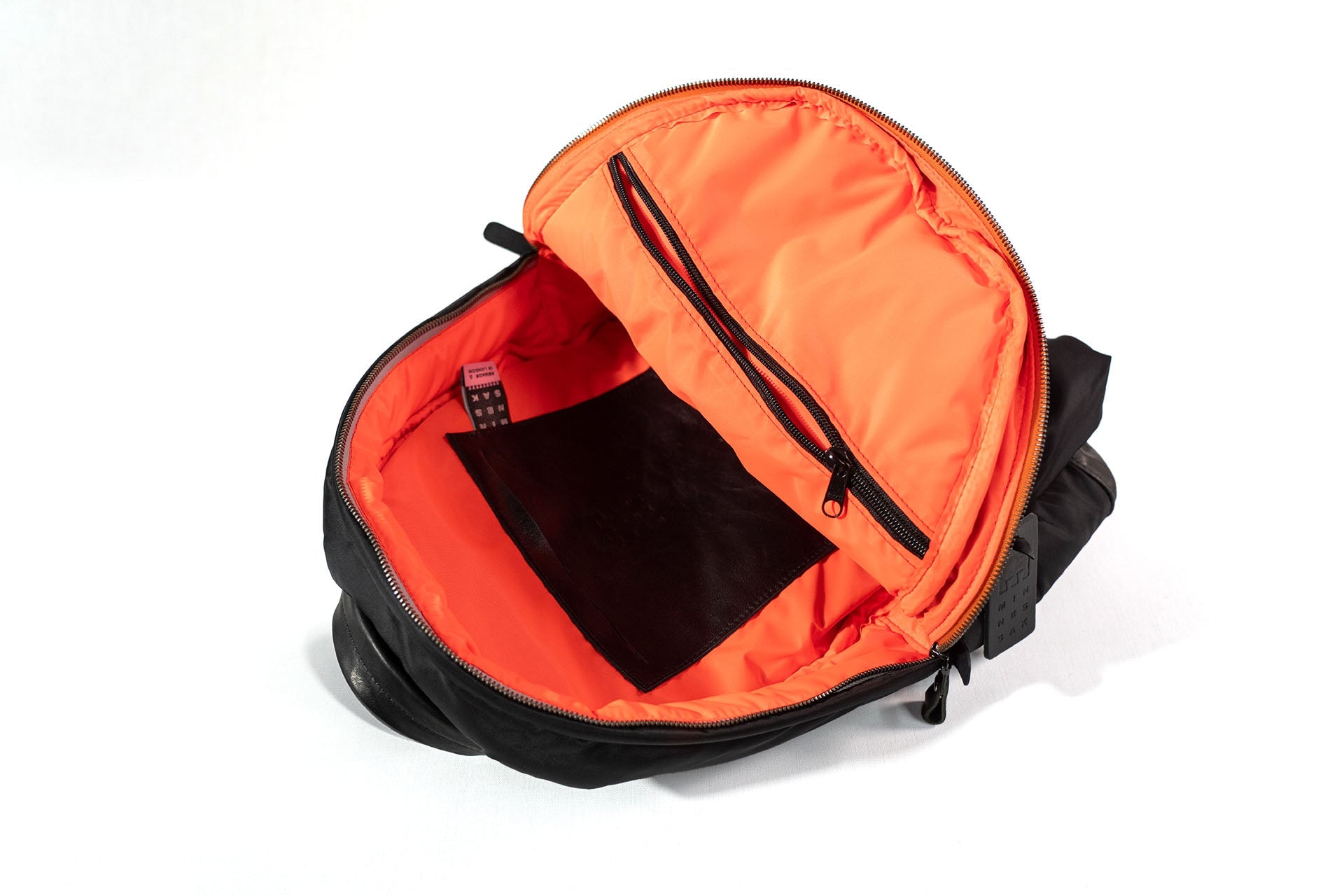 Black backpack with Orange interior on a white background