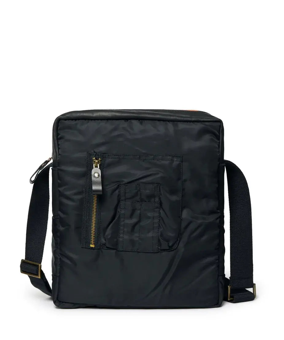 Black backpack with a strap and a front pocket and zipper on a white background