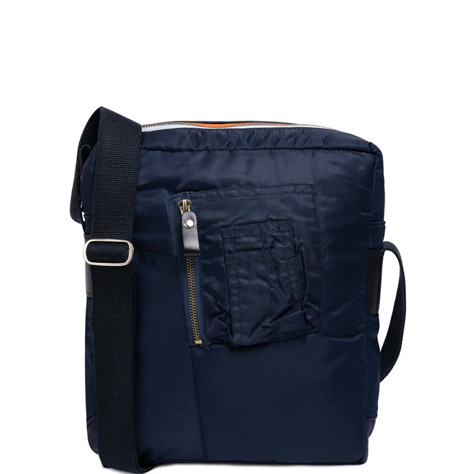 Navy blue backpack with a shoulder strap on a white background