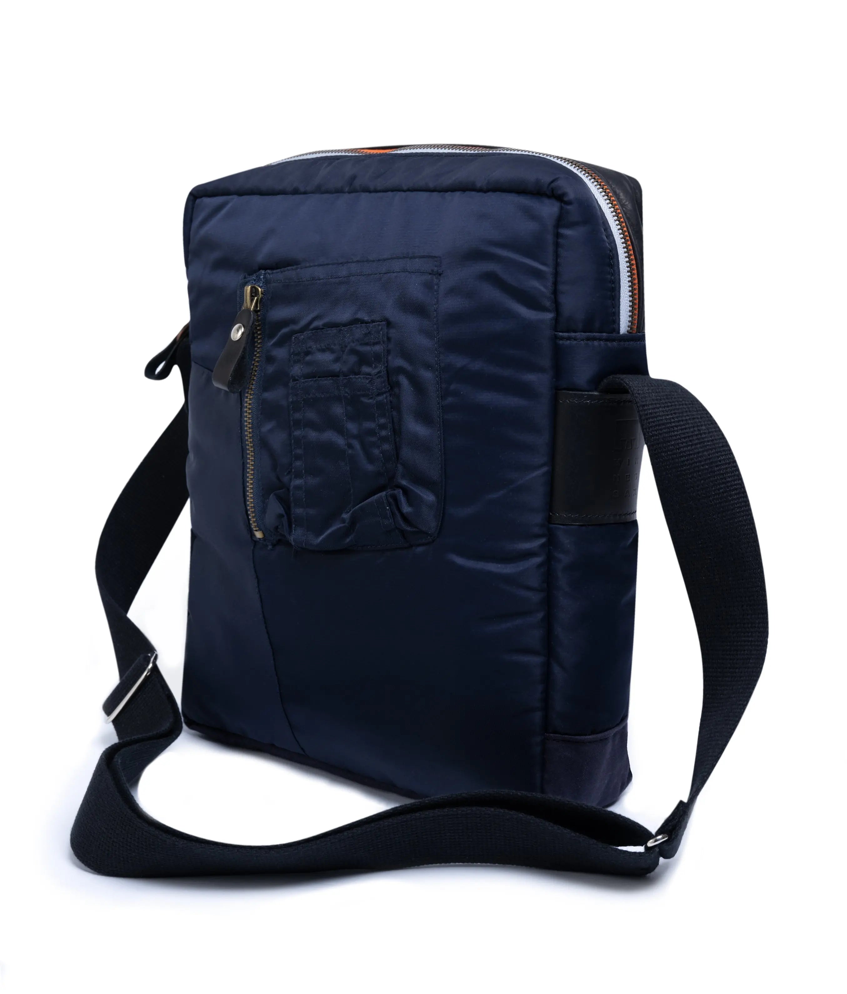 Navy blue shoulder bag with a strap on a white background