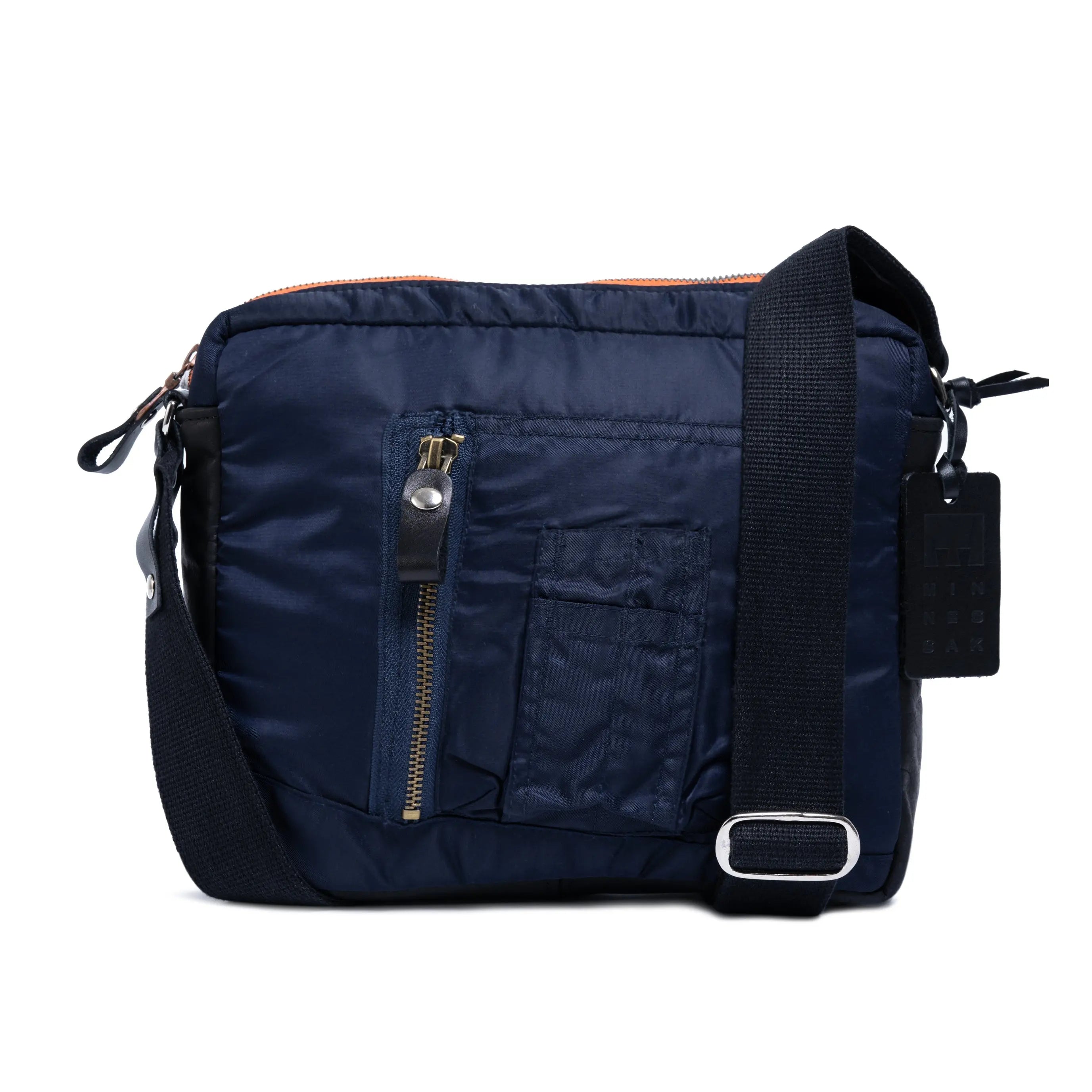 Navy blue shoulder bag with black strap on a white background