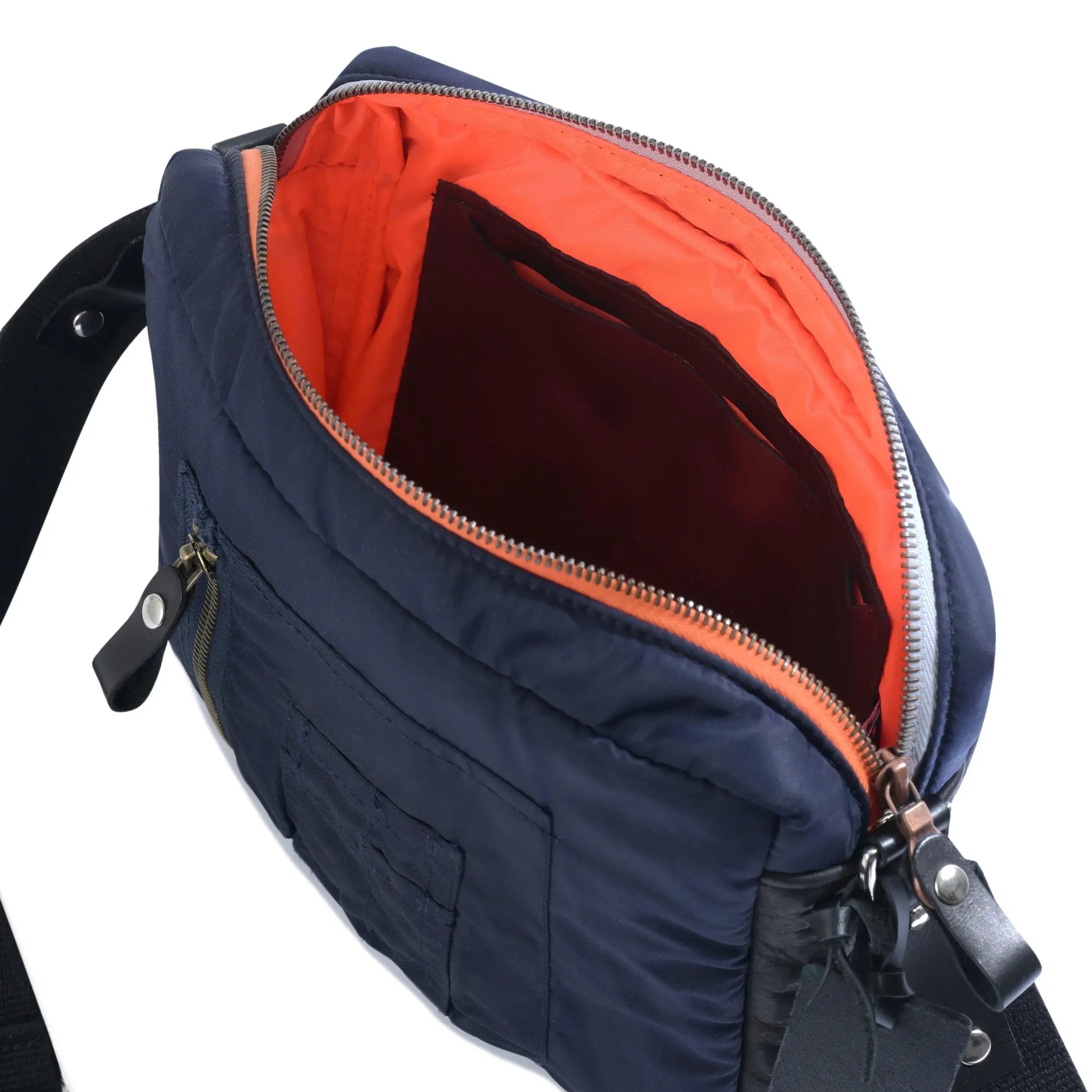 Navy blue shoulder bag with orange interior on a white background
