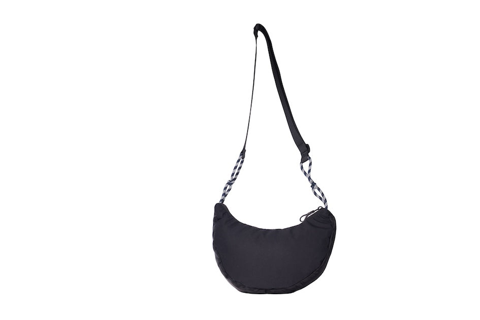 Black Boat Small sustainable crescent crossbody bag handmade from deadstock Halley Stevensons dry waxed cotton material, with adjustable shoulder strap.