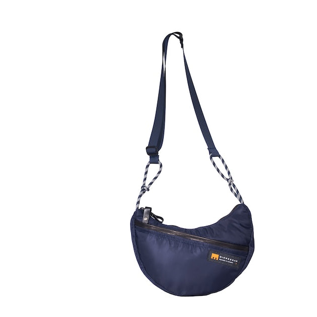 Navy Boat Small sustainable crescent crossbody bag handmade from repurposed MA-1 flight jacket material with adjustable shoulder strap and front zip pocket. Front