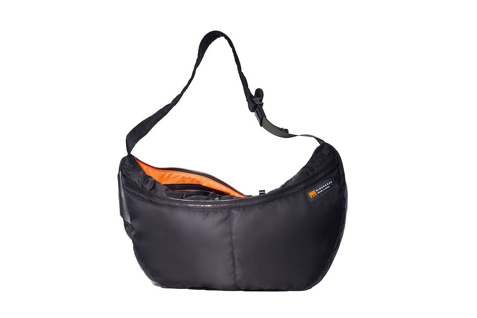 Black Boat Large ,front, sustainable crossbody bag handmade from repurposed MA-1 flight jacket material with adjustable strap, two front zip pockets and recycled orange polyester lining.