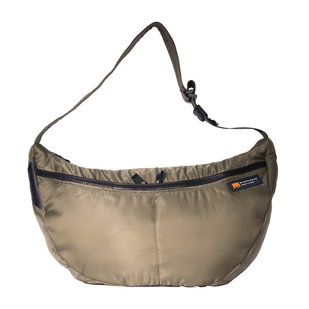 Olive Boat Large front sustainable crossbody bag handmade from repurposed MA-1 flight jacket material with adjustable strap and two front zip pockets.
