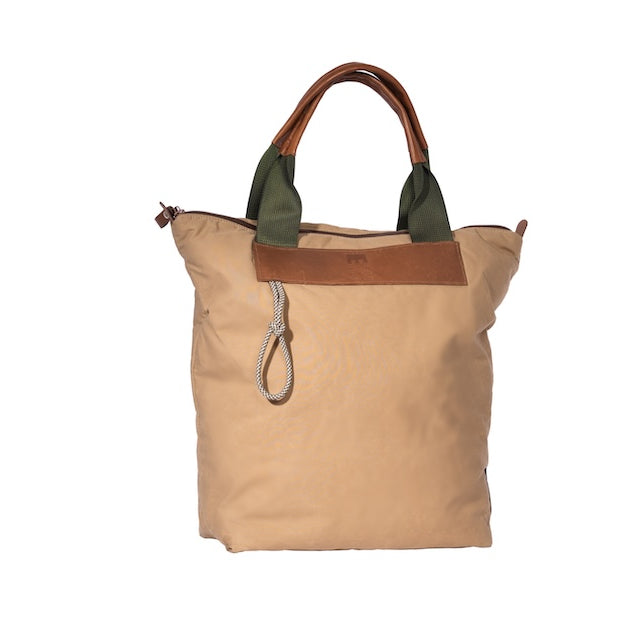 Beige Gripper tote bag made from deadstock Halley Stevensons dry waxed cotton with polypropylene handles and vintage Italian leather grips and cord detail. Handmade in London.