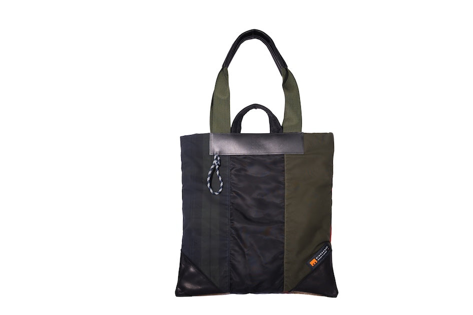 Multicolour Patch Up tote bag handmade from repurposed MA-1 flight jacket and deadstock dry waxed cotton panels with leather details.