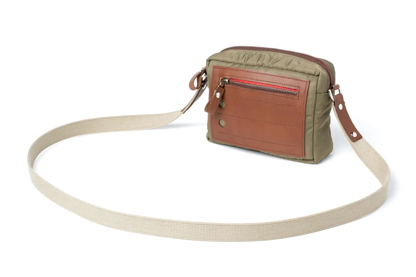 Crossbody bag with a strap on a white background