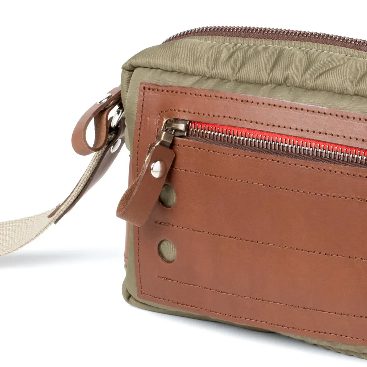 Two-tone crossbody bag with brown leather and beige fabric on a white background