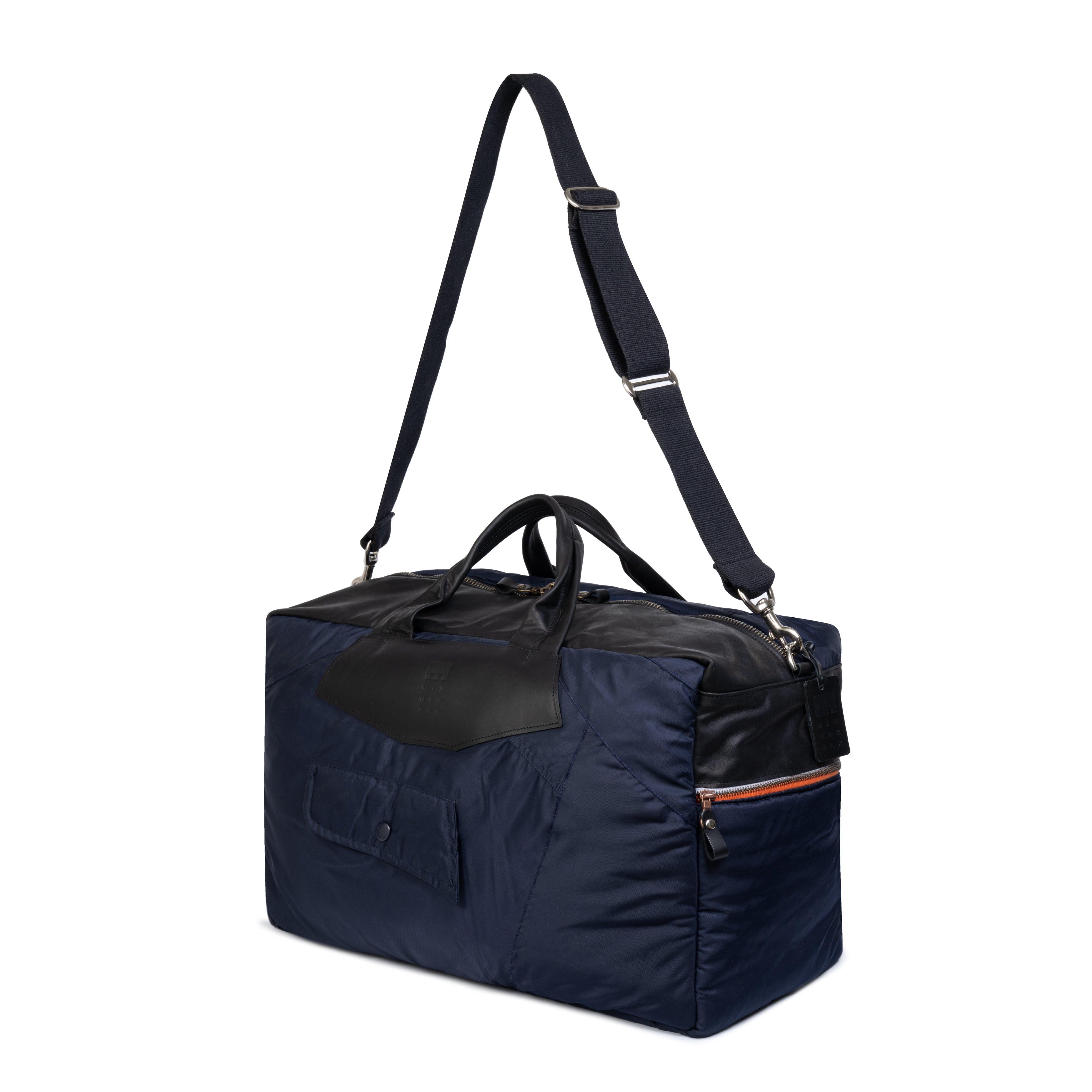 Navy blue duffel bag with black accents on a white background