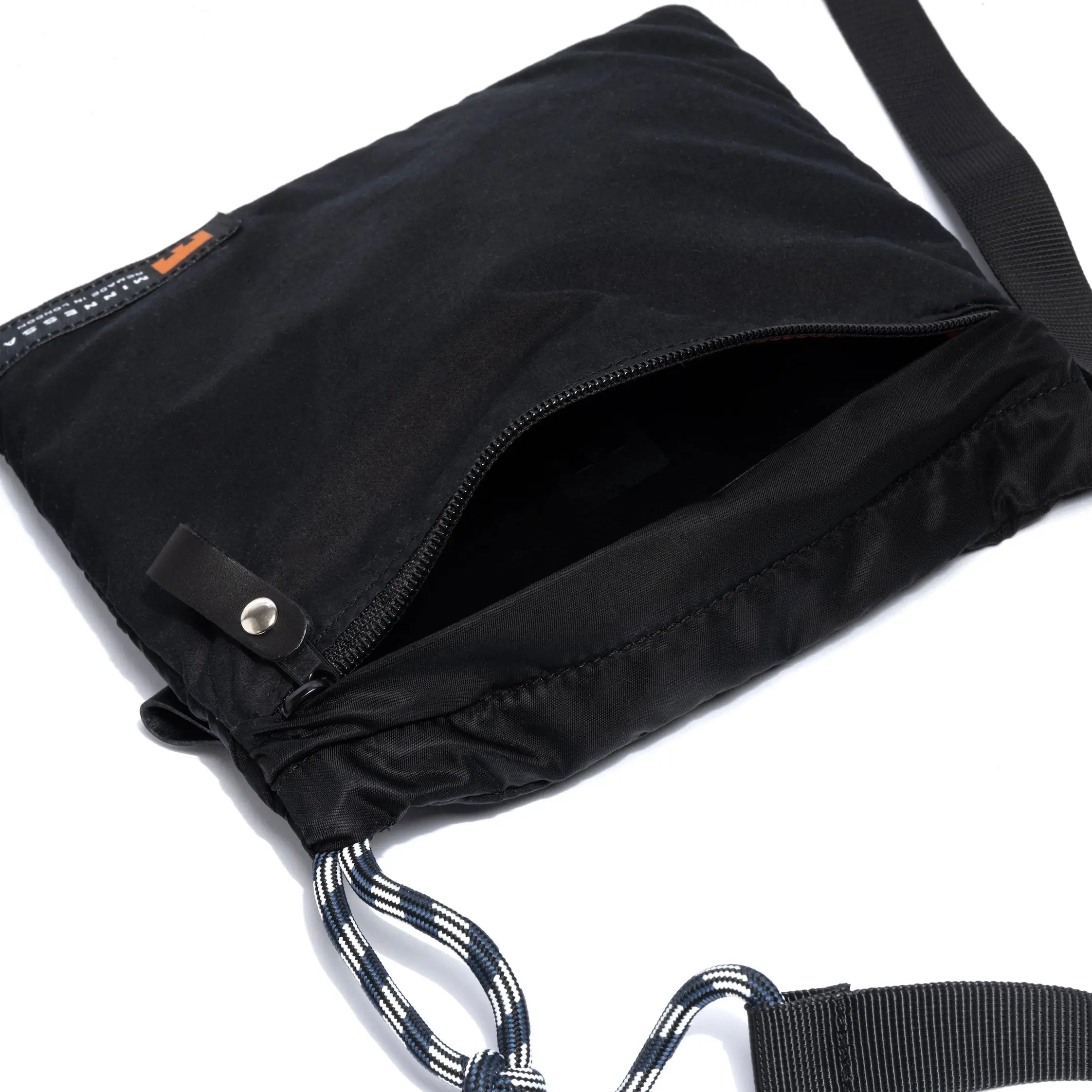Black drawstring bag with a strap on a white background