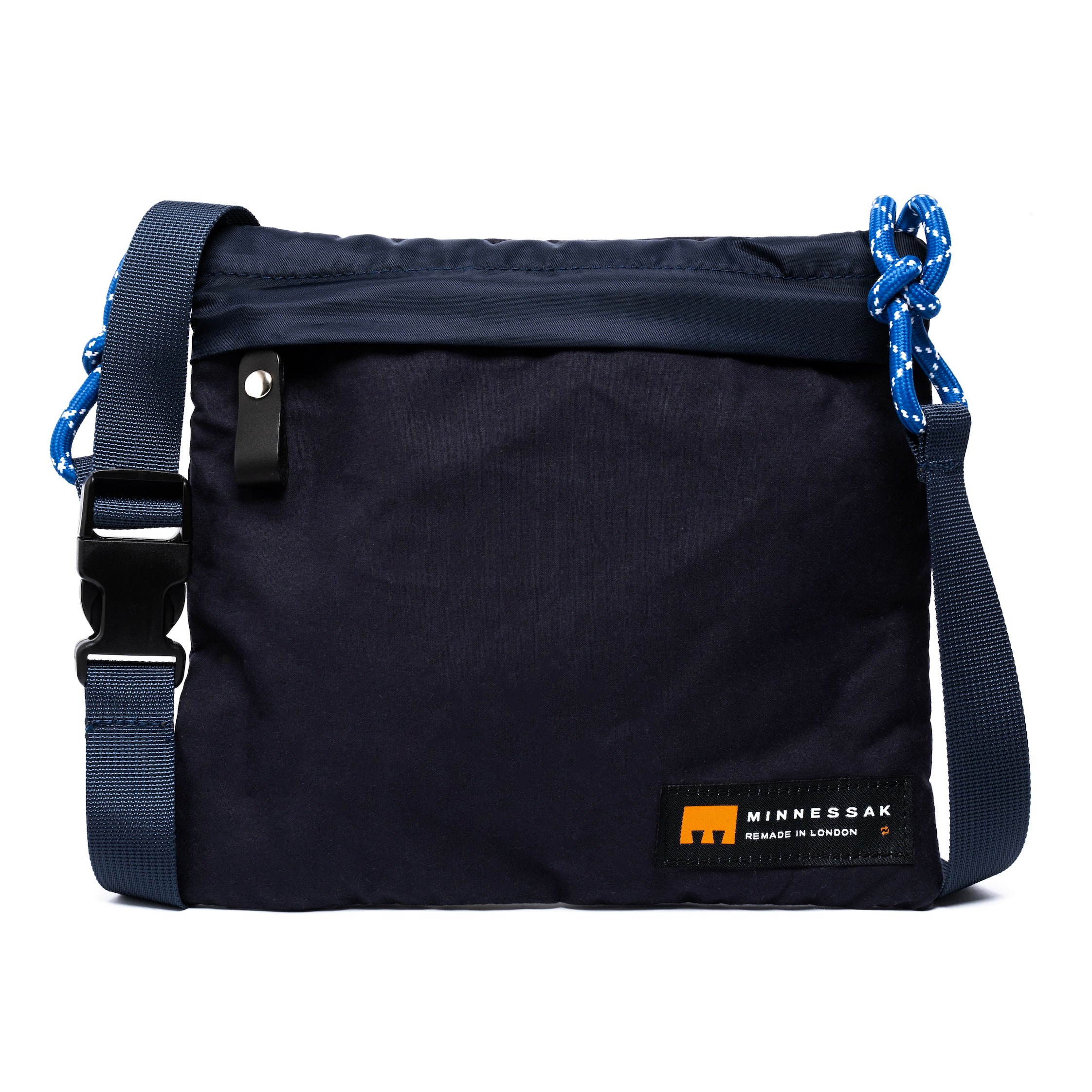Black bag with blue straps and Minnessak label on a white background