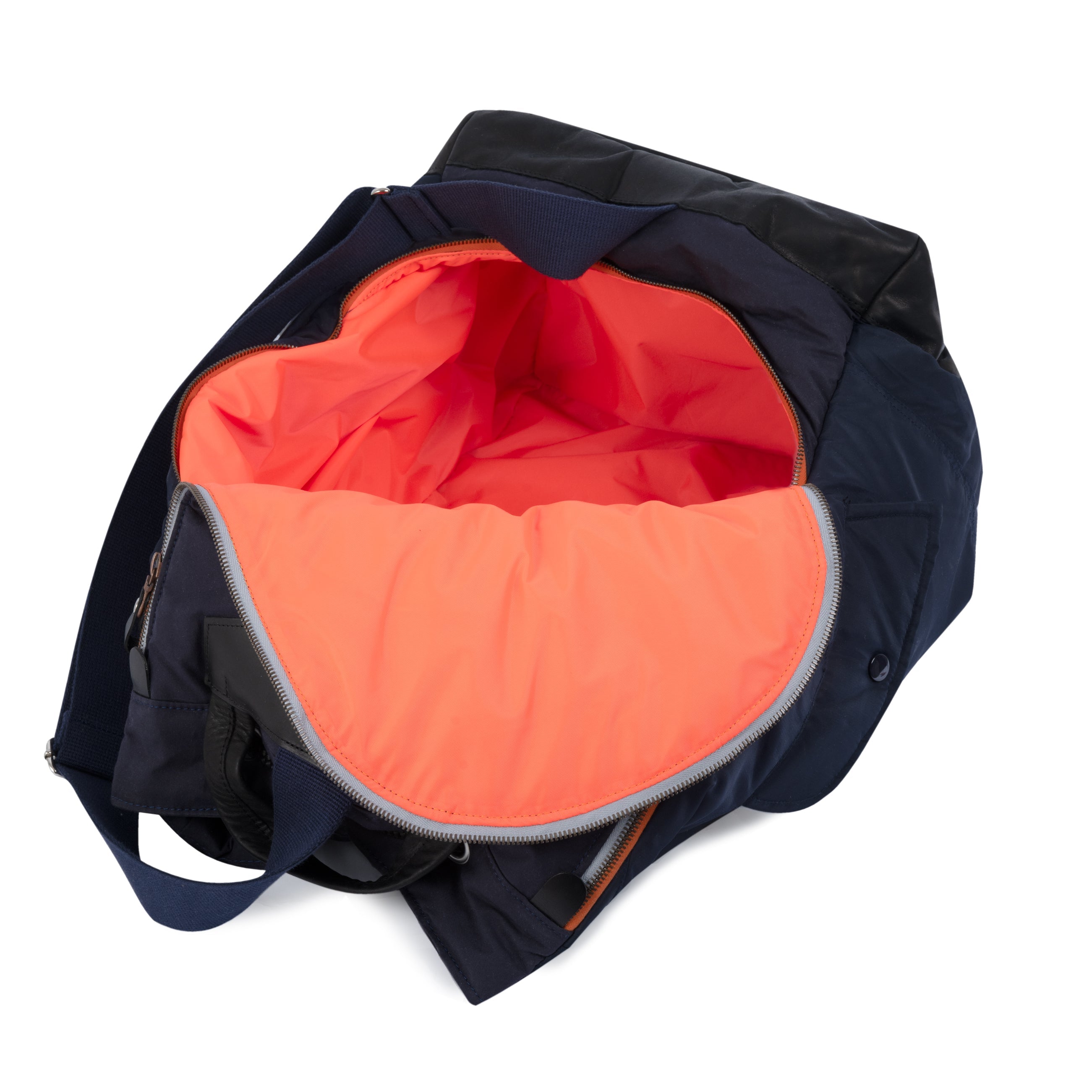 Navy blue and orange bag with open compartment showing orange interior on a white background.