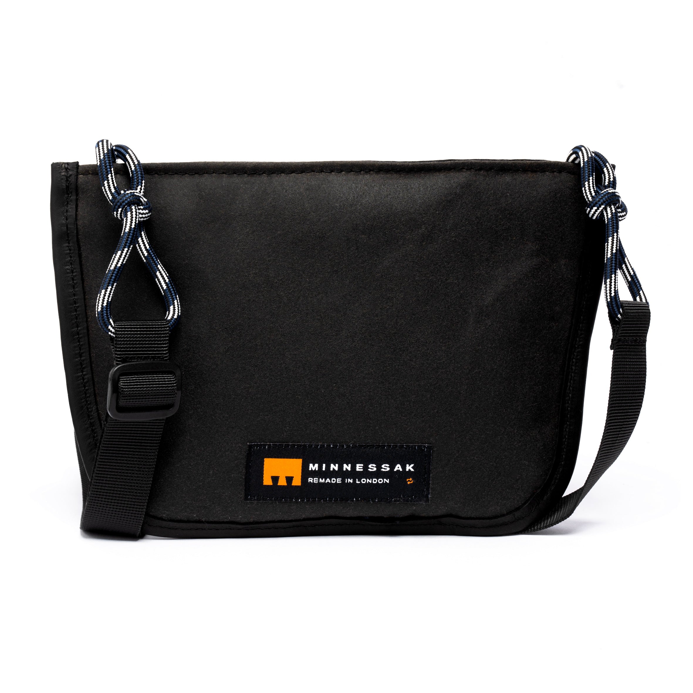 Black shoulder/cross body bag with strap detail and MInnessak logo on white background