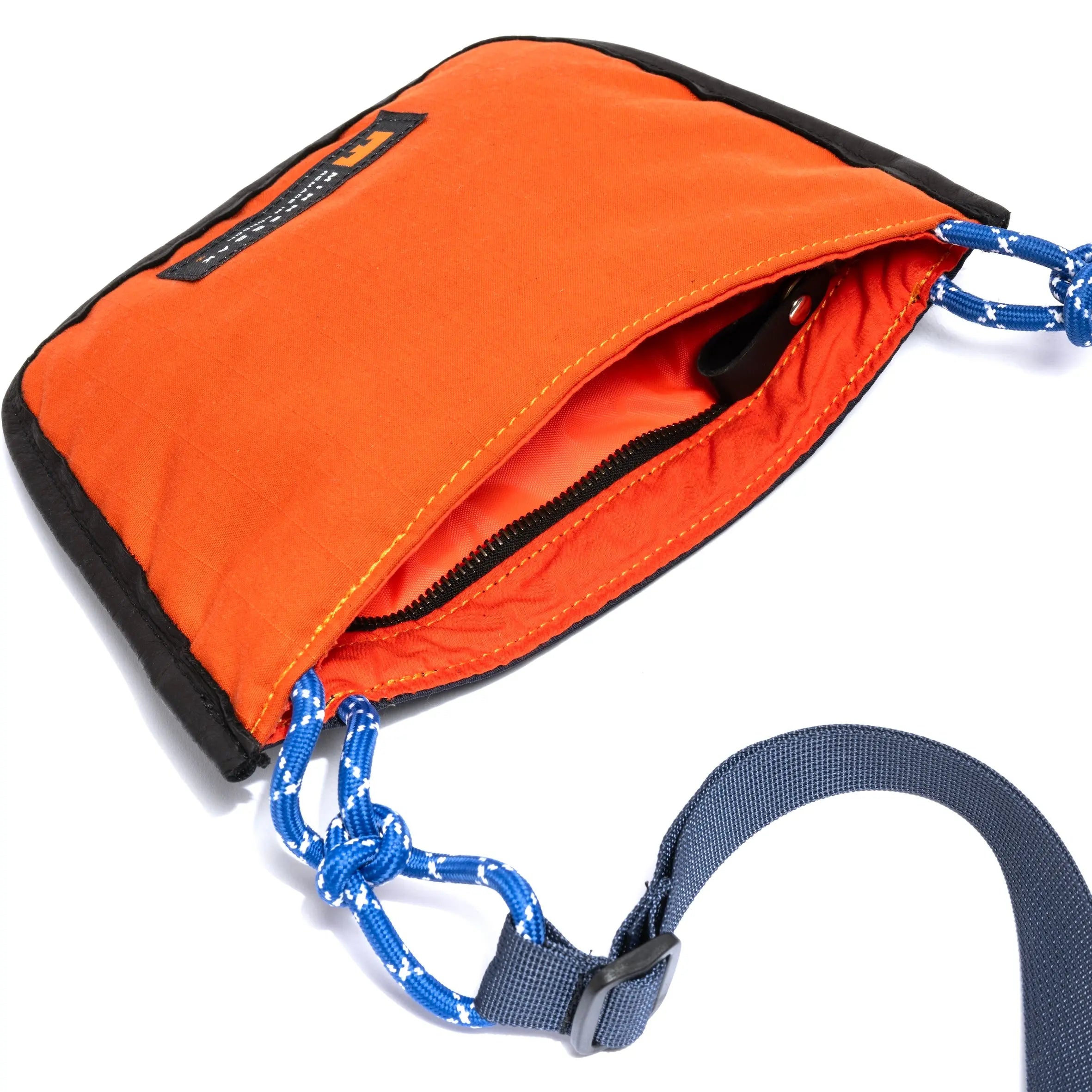 Navy & Orange shoulder/cross body bag showing internal and strap detail on white background