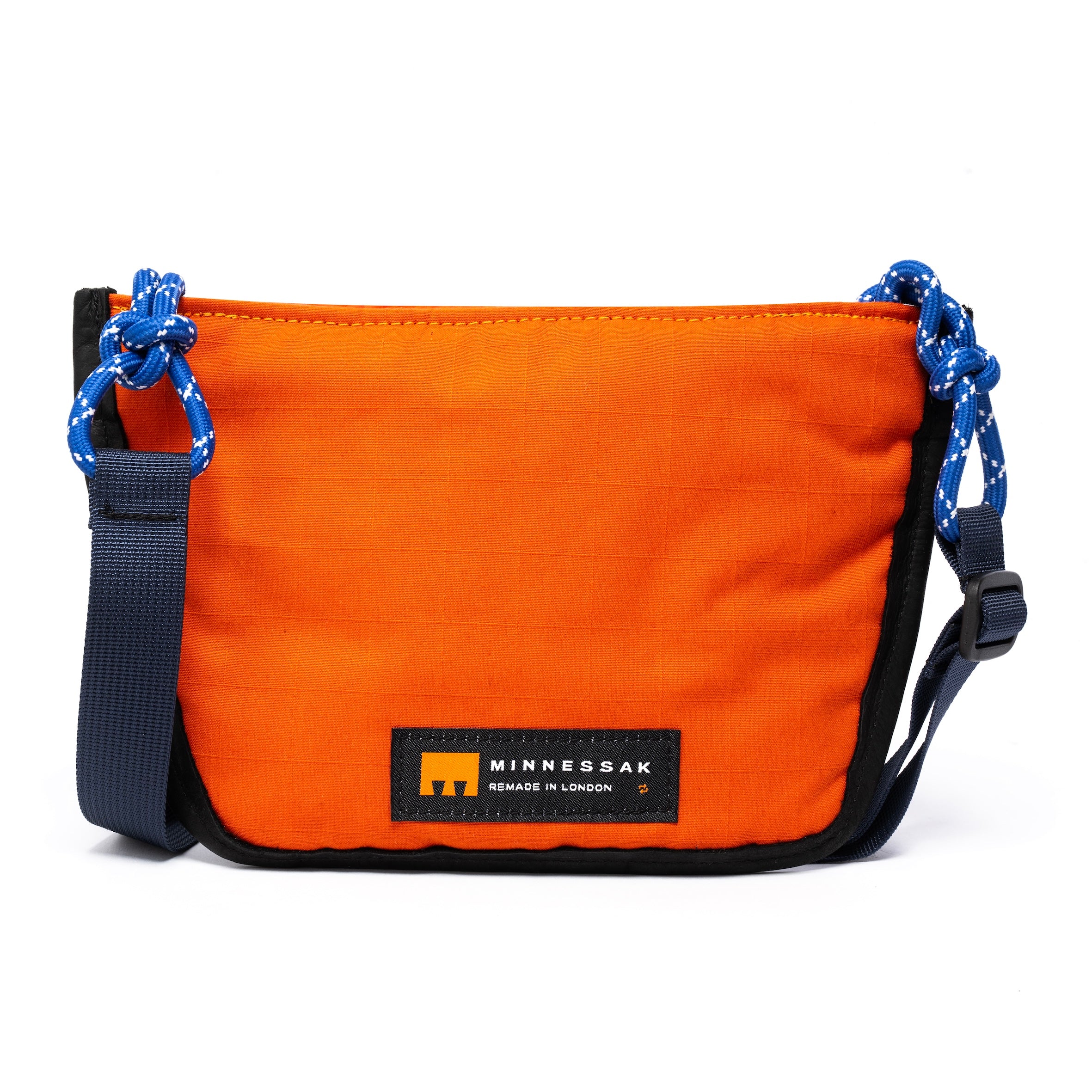 Navy & orange shoulder/cross body bag withe strap details and Minnessak logo on white background
