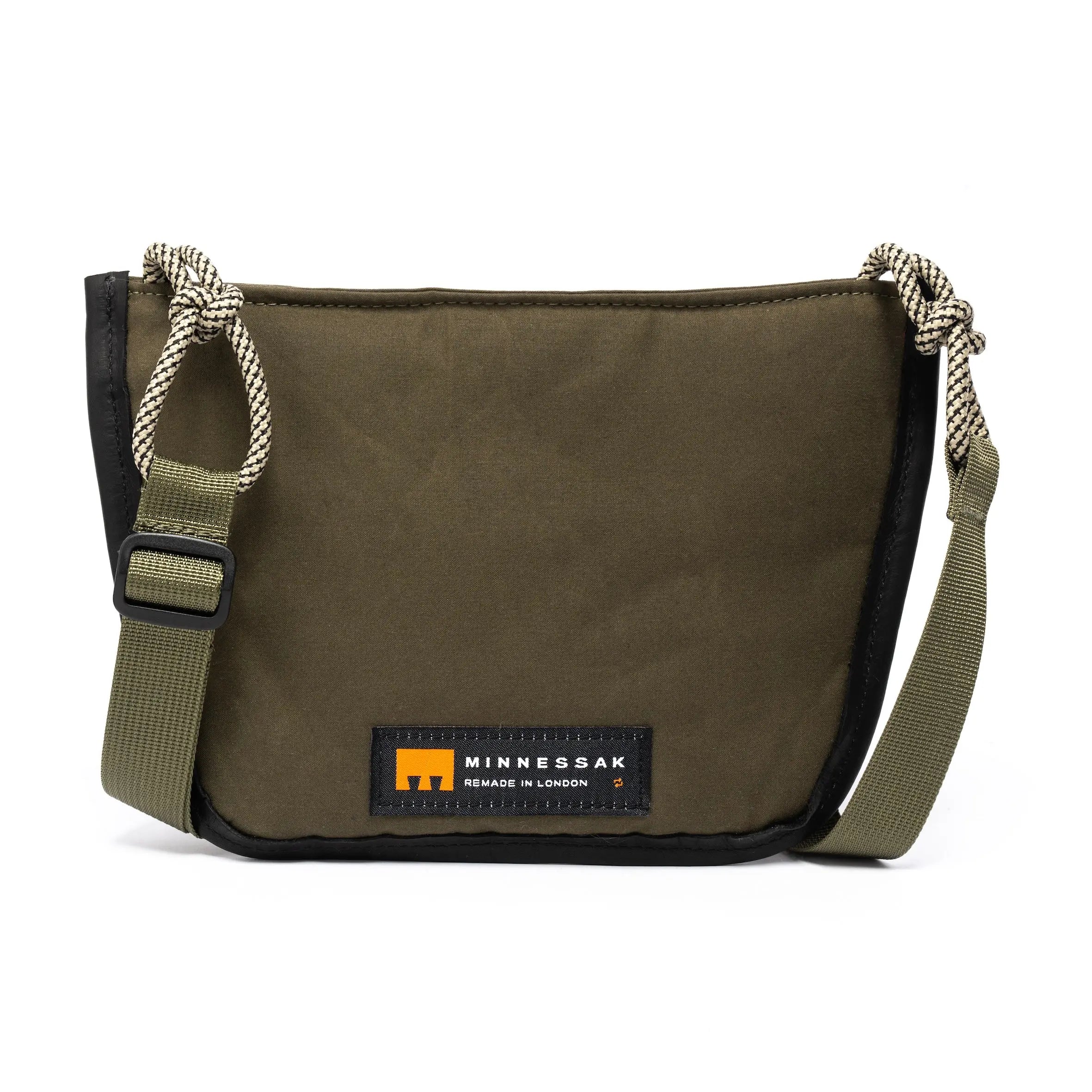 Small shoulder/cross body bag showing distinctive cord detail and MInnessak logo on white background